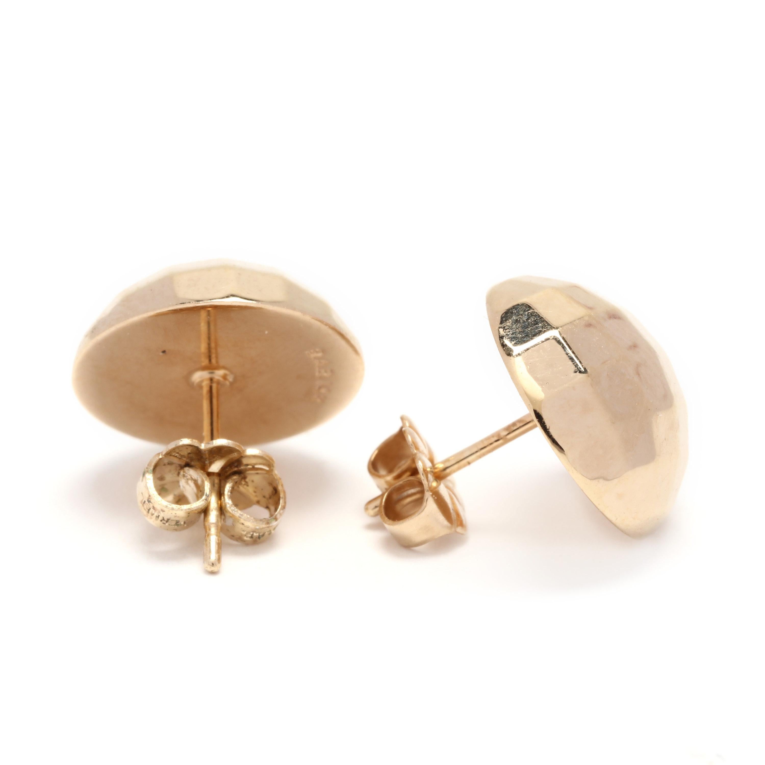 A pair of 14 karat yellow gold faceted dome stud earrings. A circular faceted dome design with pierced push backs.

Length: 1/2 in.

1.7 dwts.
