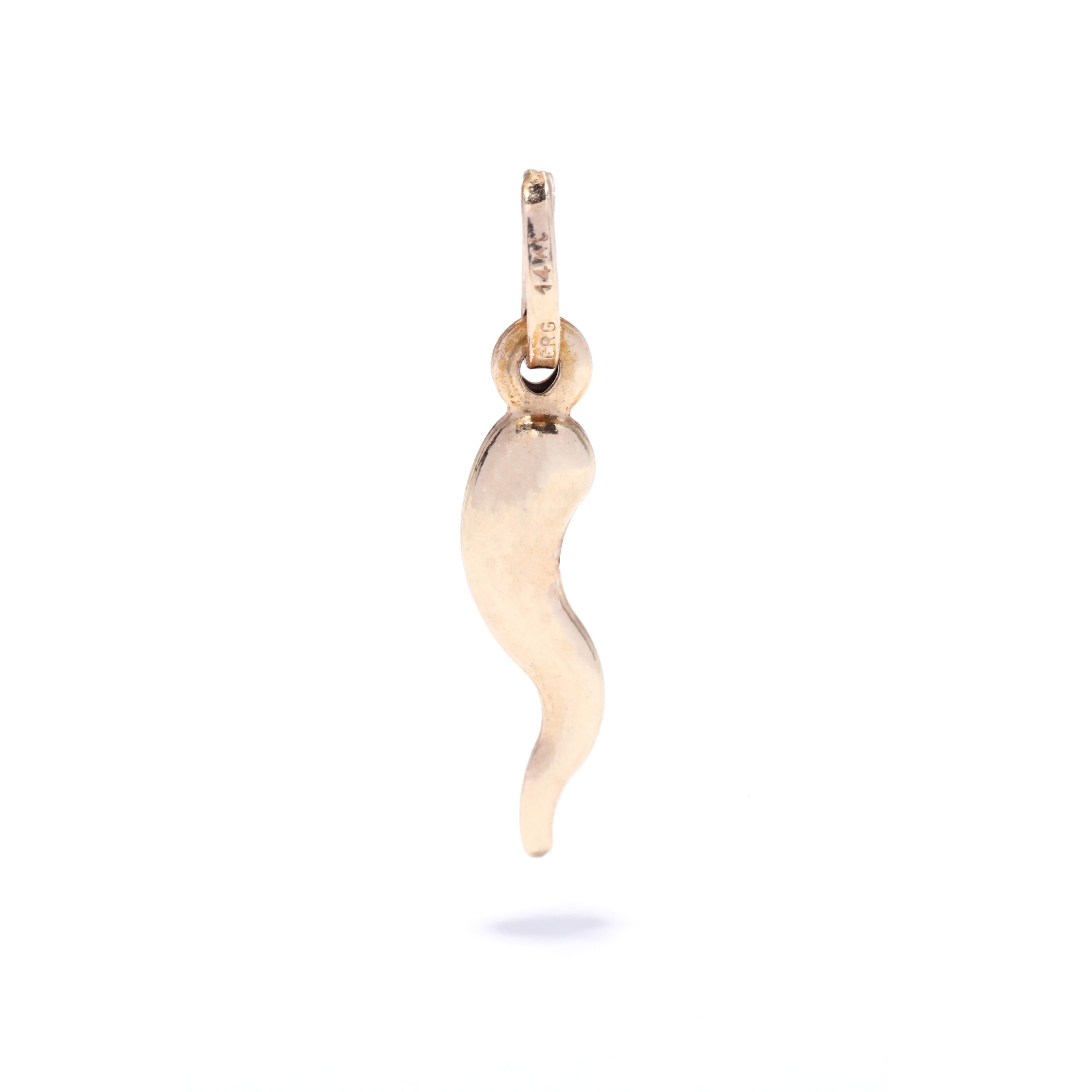 A vintage 14 karat yellow gold Italian horn charm. This small charm features a cornicello horn motif with a thin oval bail.

Length: 3/4 in.

Width: 3/16 in.

Weight: .30 dwts. / .47 grams

Stamps: 14K ERG


Ring Sizings & Modifications:
* We are