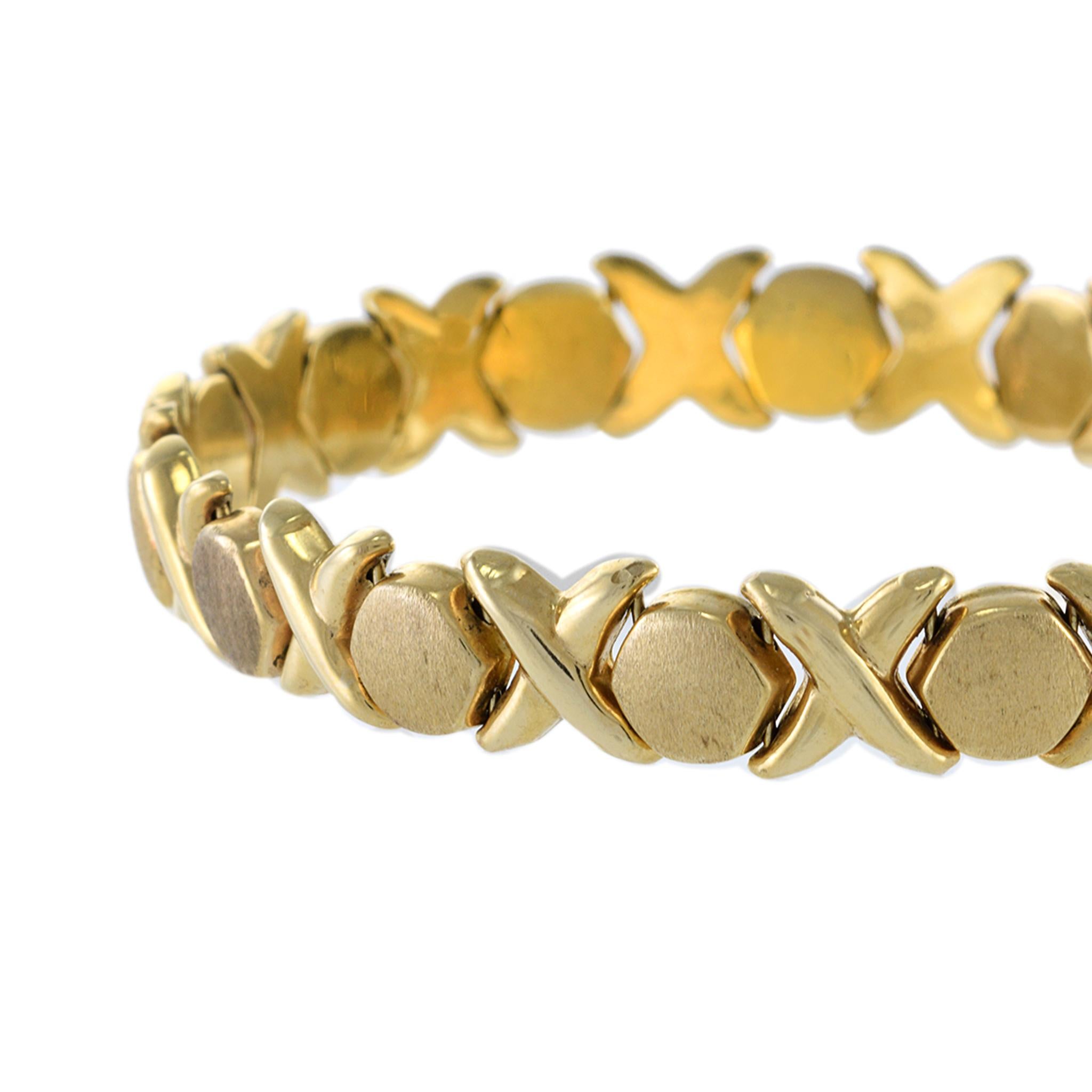Whether you're dressing up for a special occasion or looking to add some timeless elegance to your everyday wardrobe, this Italian made bracelet is the perfect choice. Crafted with 14KT yellow gold, its classic XO link design exudes sophistication