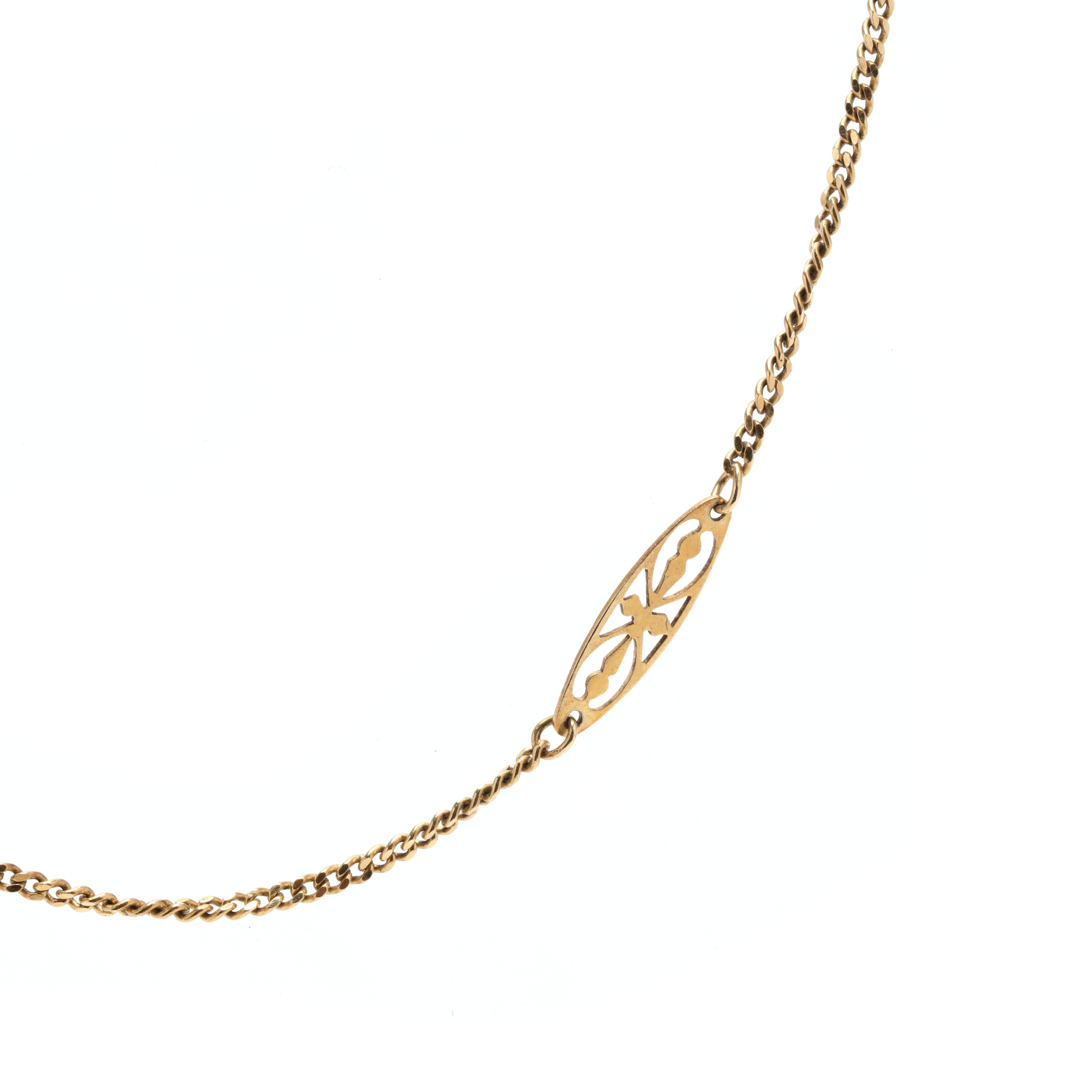 A vintage 14 karat yellow gold lozenge and curb link chain necklace. This chain features nine lozenge links with filigree detailing, each connected with a thin curb link chain and with a spring ring clasp.

Length: 20 in.

Width: 4.4 mm

3.2