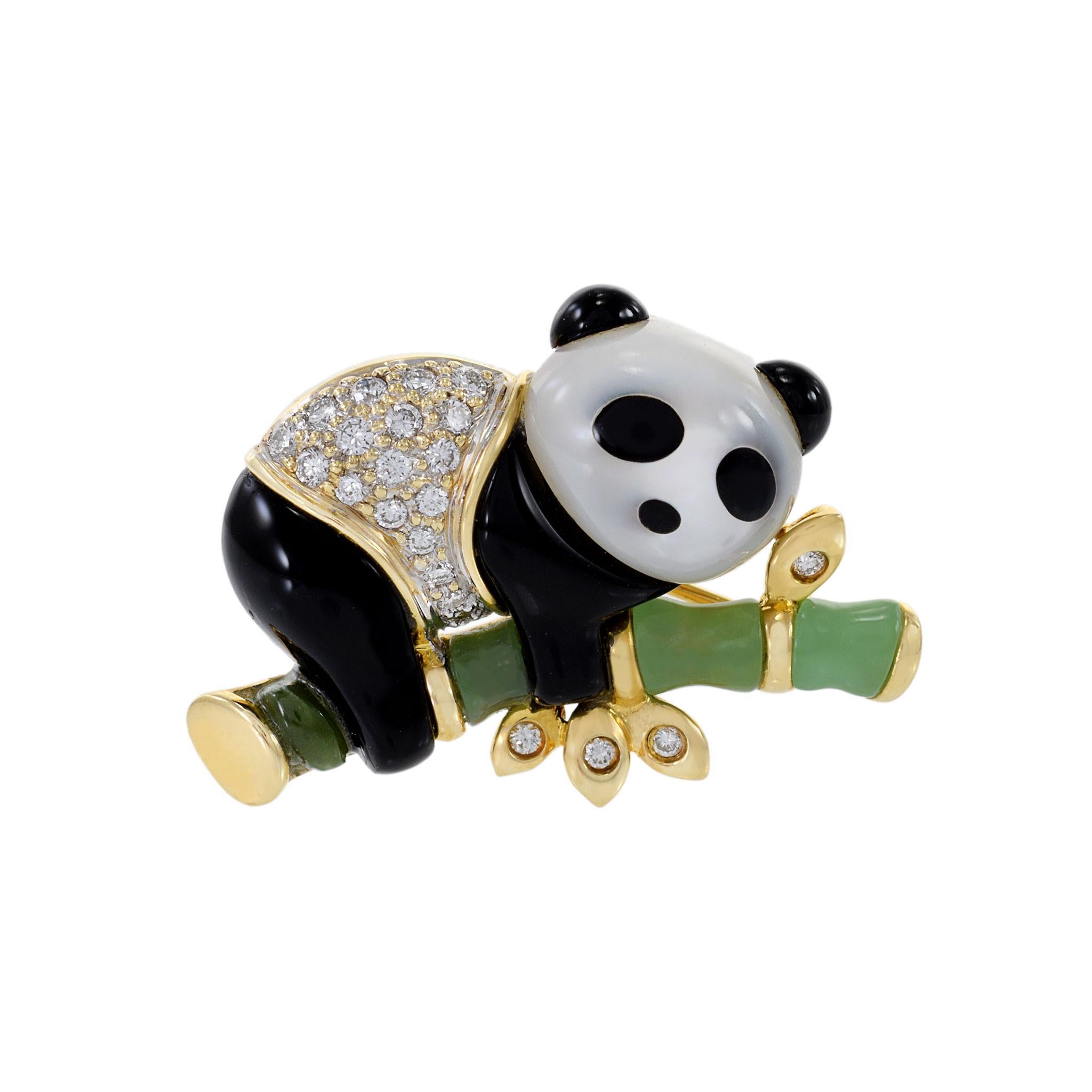 Make a statement and add a touch of timeless elegance to your wardrobe with this vintage retro era  14KT yellow gold mother of pearl, onyx and jade Panda brooch.