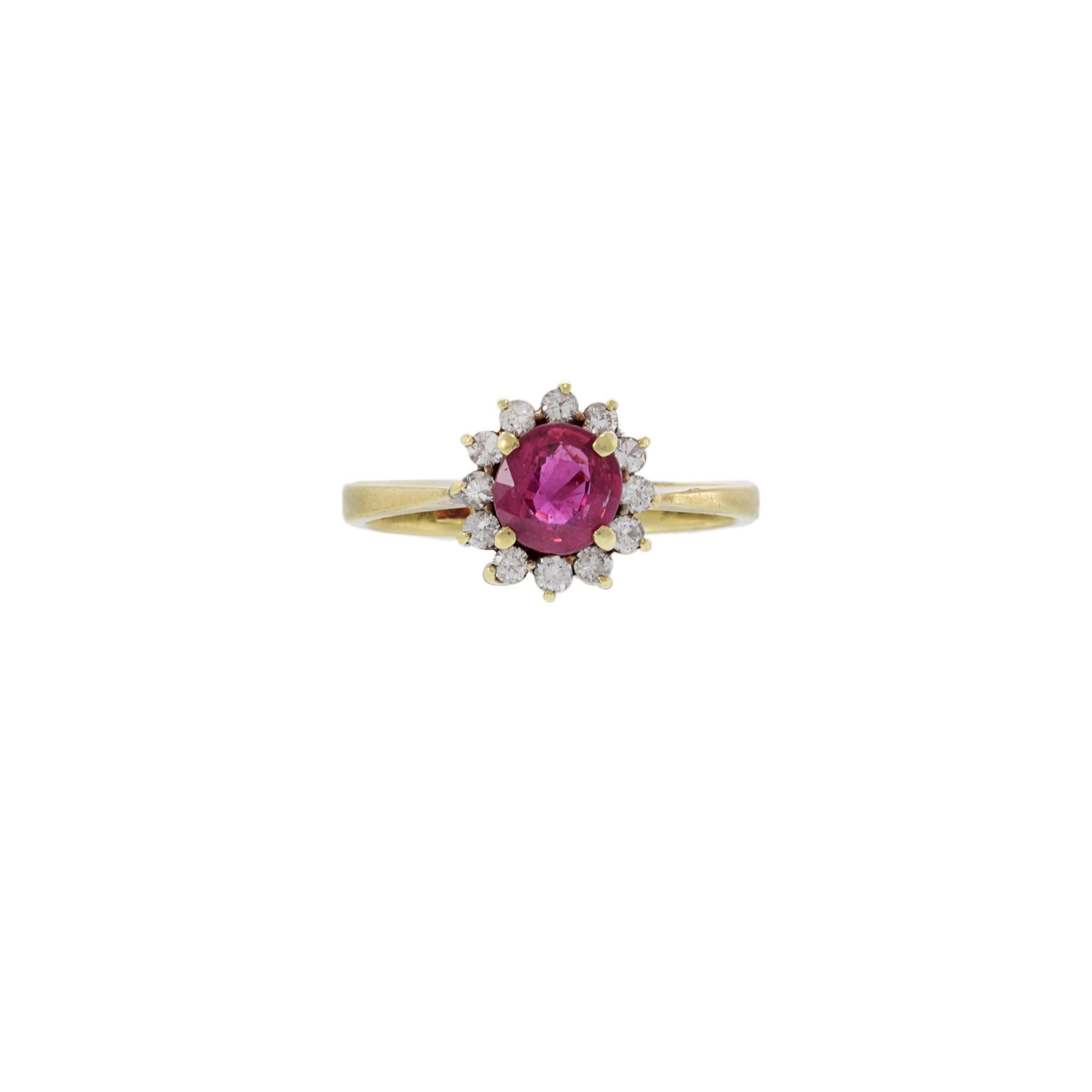 Step out in style with this exquisite vintage 14KT yellow gold ruby and diamond ring. Featuring a stunning .80ct round cut ruby and twelve .25CT-TW round cut diamonds, this ring is sure to make a statement. The perfect combination of opulence and