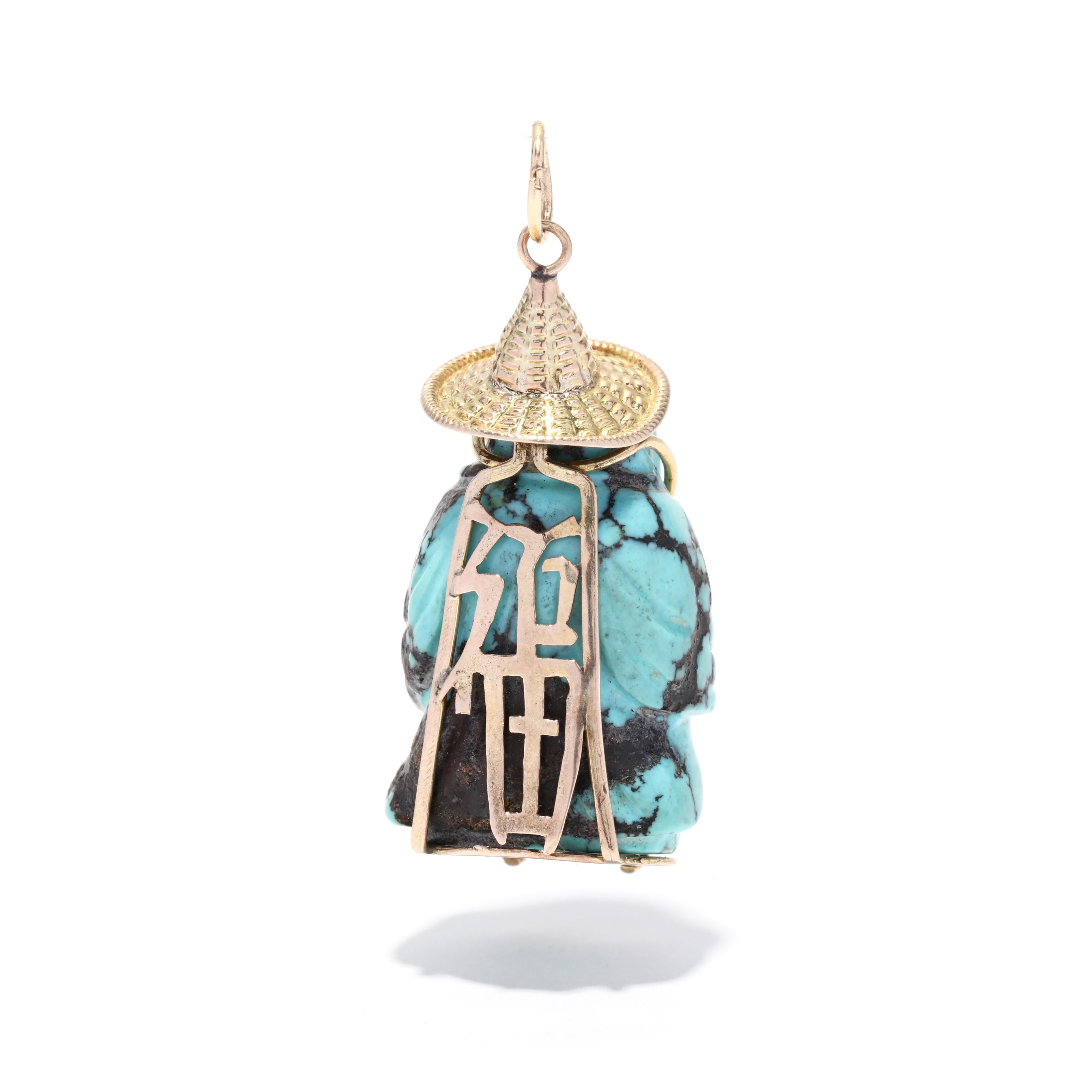 A vintage 14 karat yellow gold turquoise buddha charm, This large charm features a carved turquoise stone in Buddha motif with a gold hat and small pearl bead detail.

Length: 1.5 in.

Width: 5/8 in.

Weight: 6.4 dwts. / 9.95 grams

Stamped:
