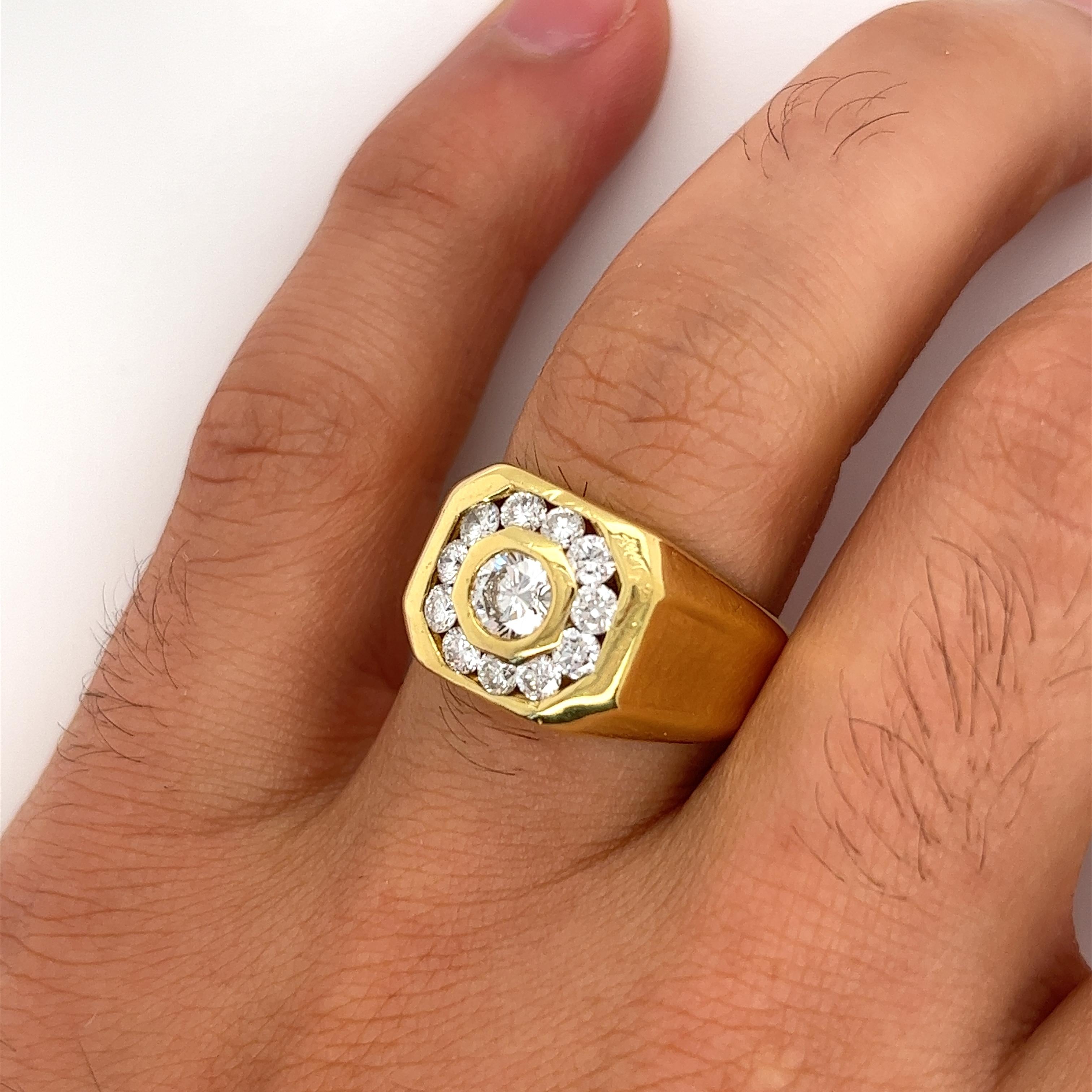Vintage 1.50 CTTW Men's Round Cut Natural Diamond Ring. Crafted in 18K solid yellow gold. Featuring a bezel-set center stone and a channel-set diamond halo adorning the center. The finish is polished, with smooth edges that glide smoothly on the