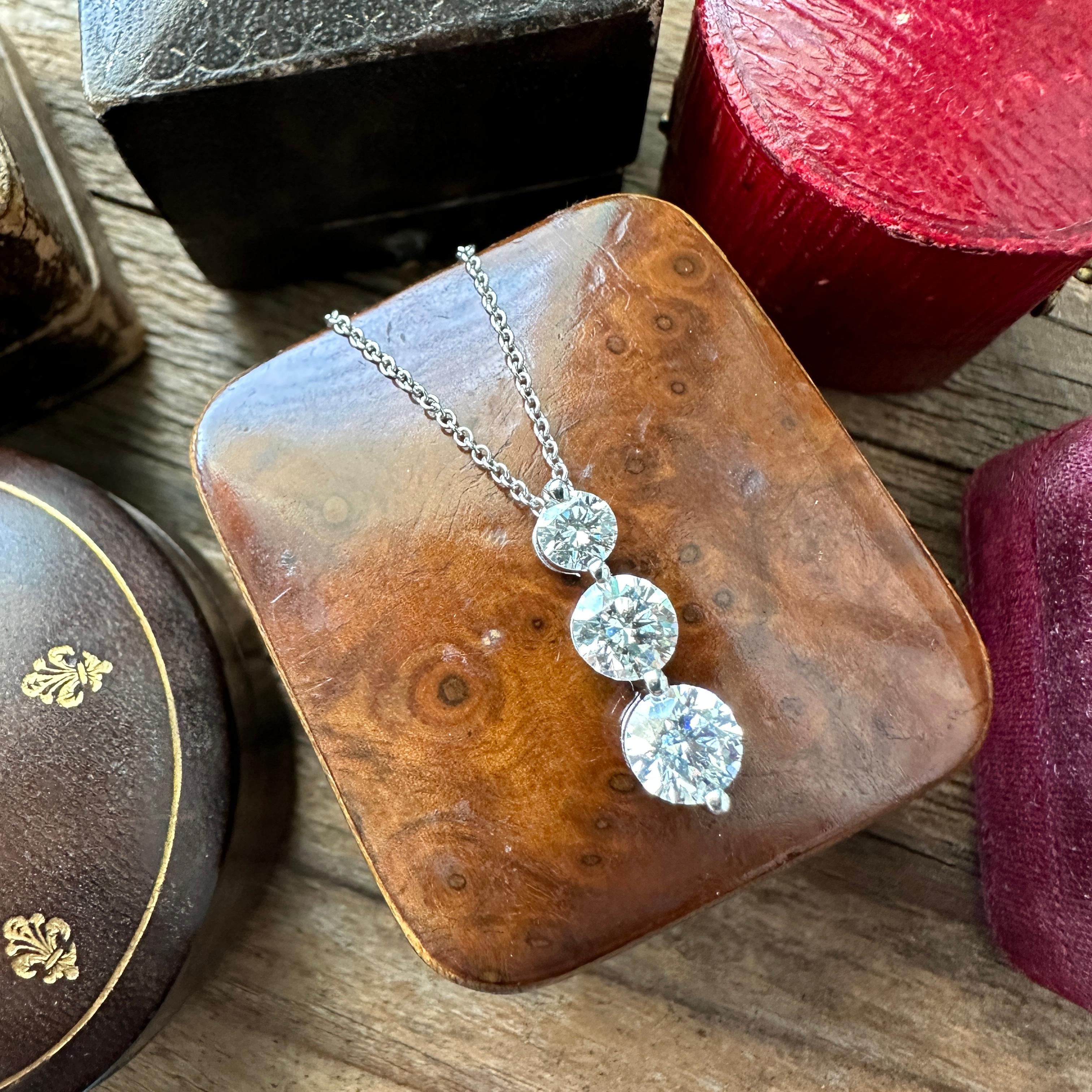Details:
Fabulous classic vintage triple diamond drop pendant set in 18K white gold. Perfect EVERYDAY necklace with just the right amount of bling! The diamonds total weight is 1.5 carats, and they are round brilliant cuts. This piece is gorgeous,