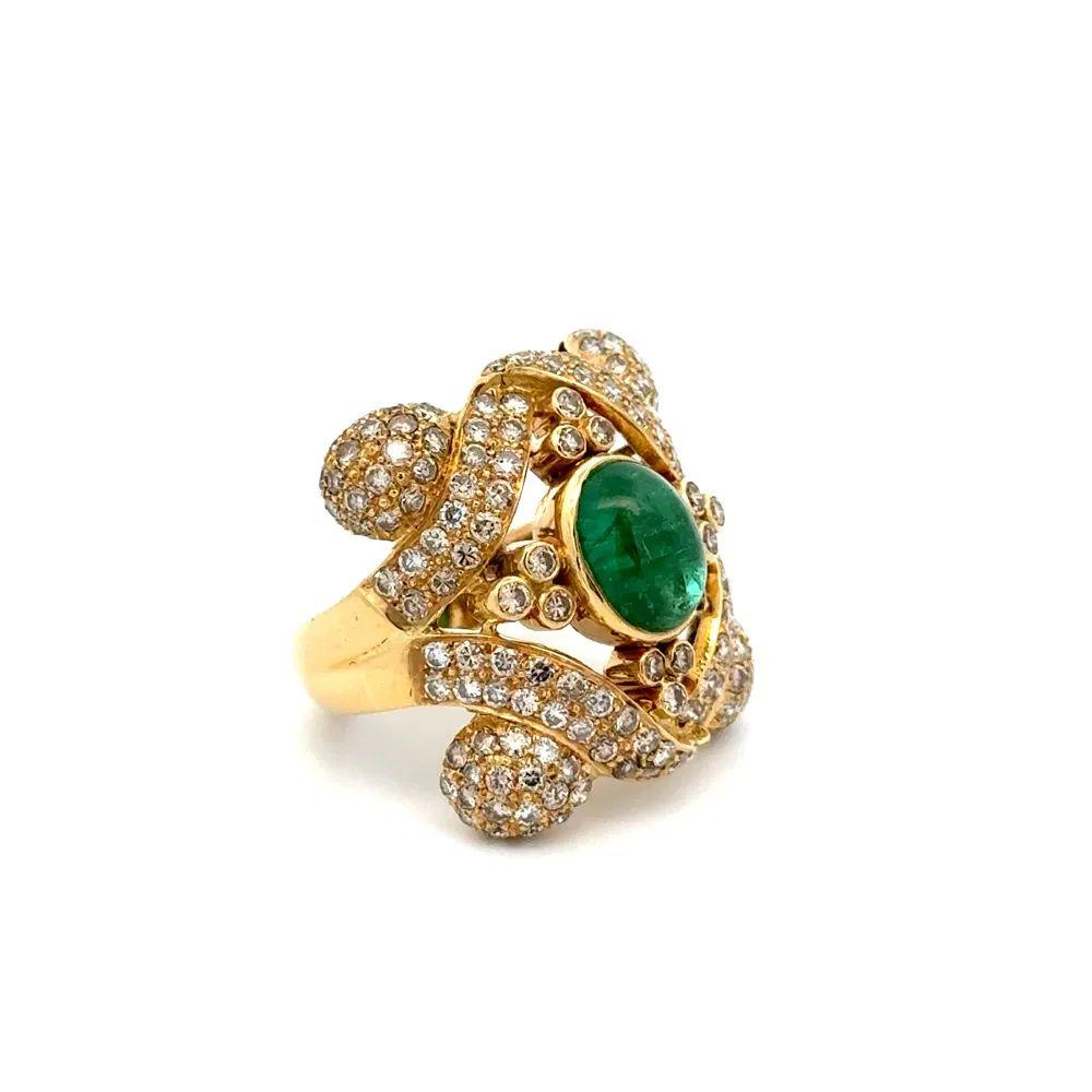 Simply Beautiful! Finely detailed Vintage Cabochon Emerald and Diamond Gold Cocktail Ring. Centering a securely Cabochon Emerald, weighing approx. 1.50 Carats. Surrounded by Round Brilliant Cut Diamonds, weighing approx. 3.00tcw. Beautifully Hand