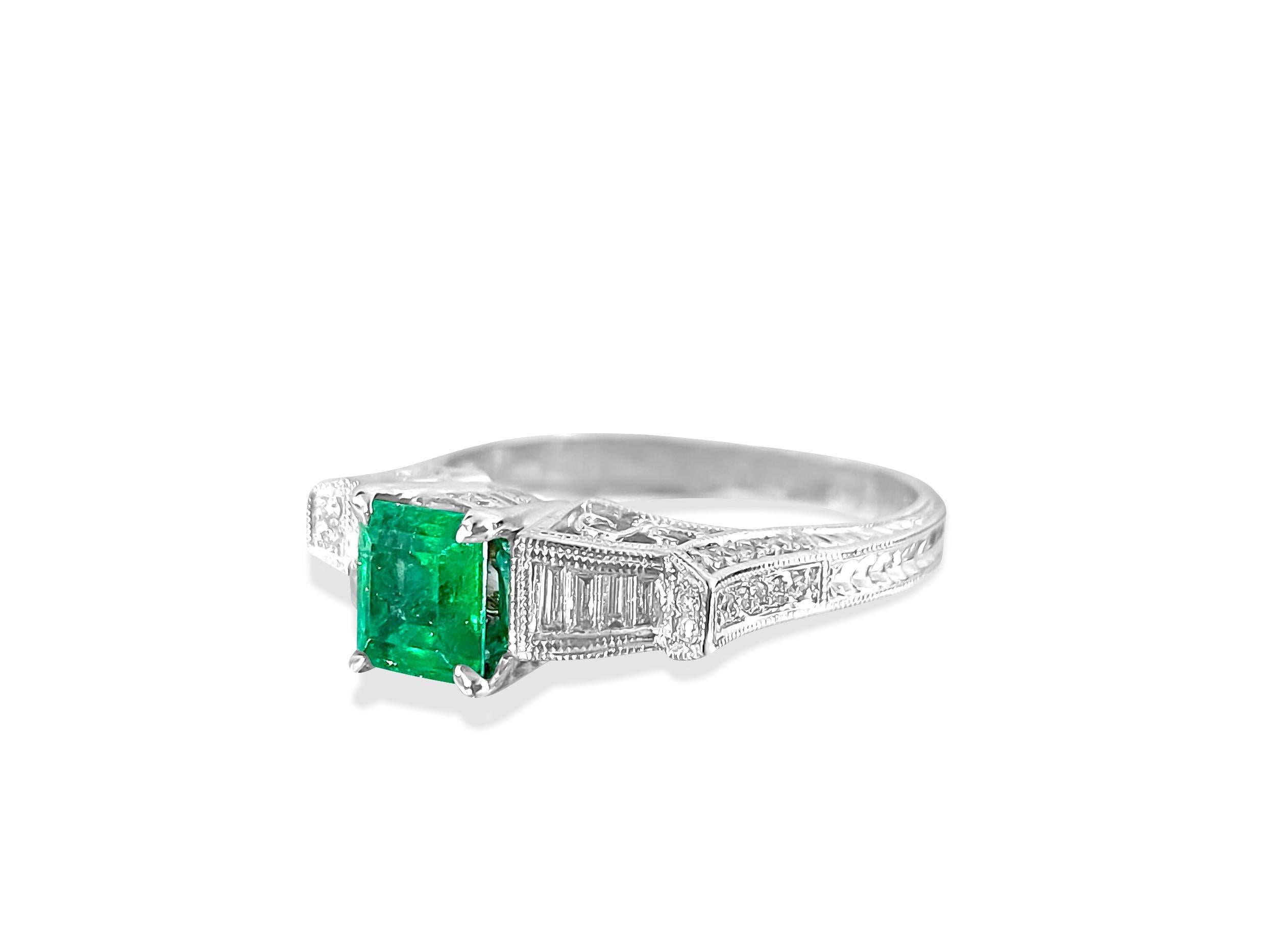 Metal: 14K white gold. 
Center: 1.50 carat emerald. 100% natural earth mined Colombian Emerald. Cut: Princess. Beautiful saturation and color. 

Side diamonds: 0.30 carat diamonds total. VS clarity and F color diamonds. Baguette cut and round