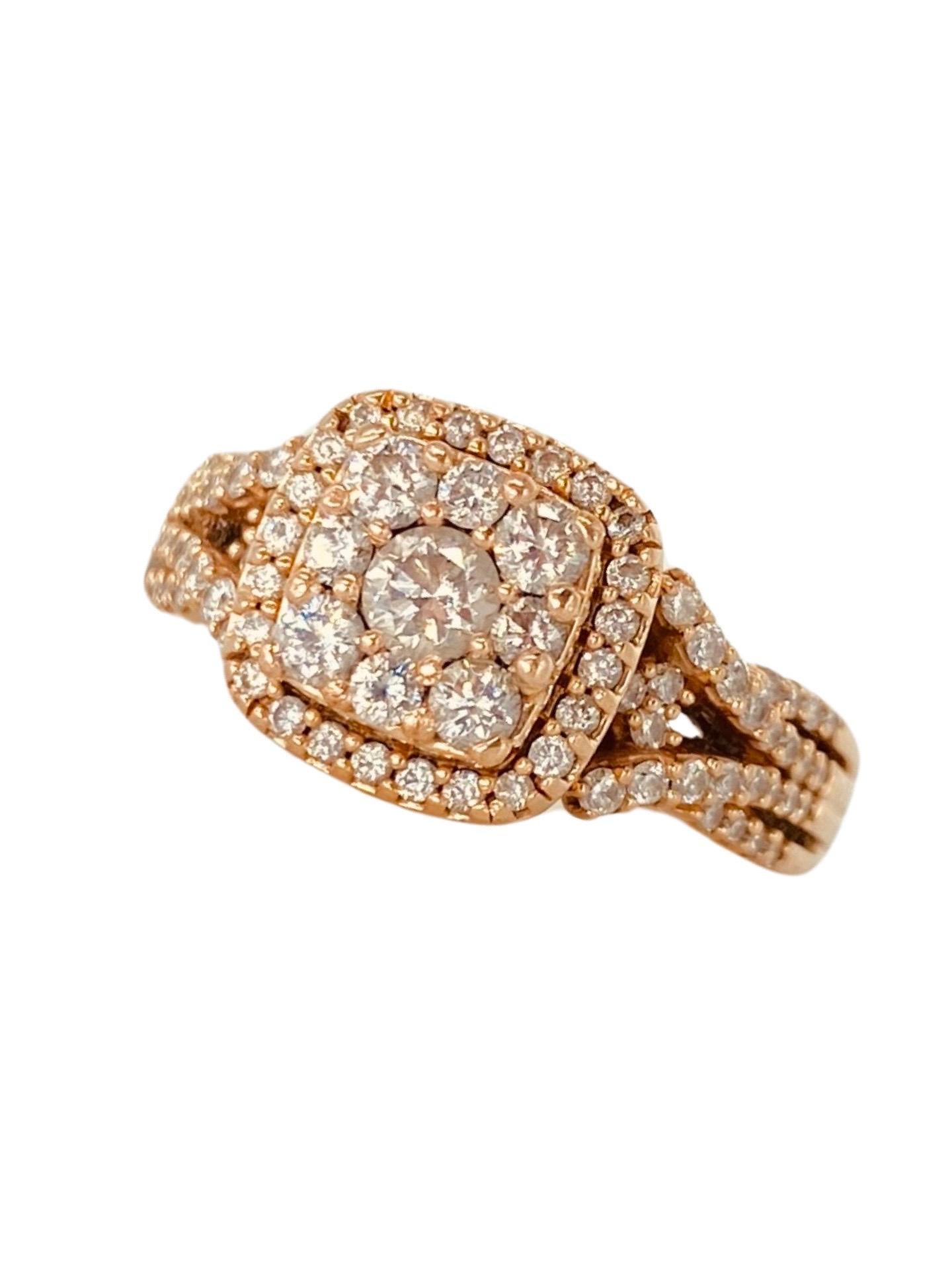 Vintage 1.50 Carat Total Weight in Diamonds Ring 14k Rose Gold. Beautiful and very impressive work on this ring by the designer. Many details are pointed out while examining the ring. There are round diamonds around the sides of the ring on the