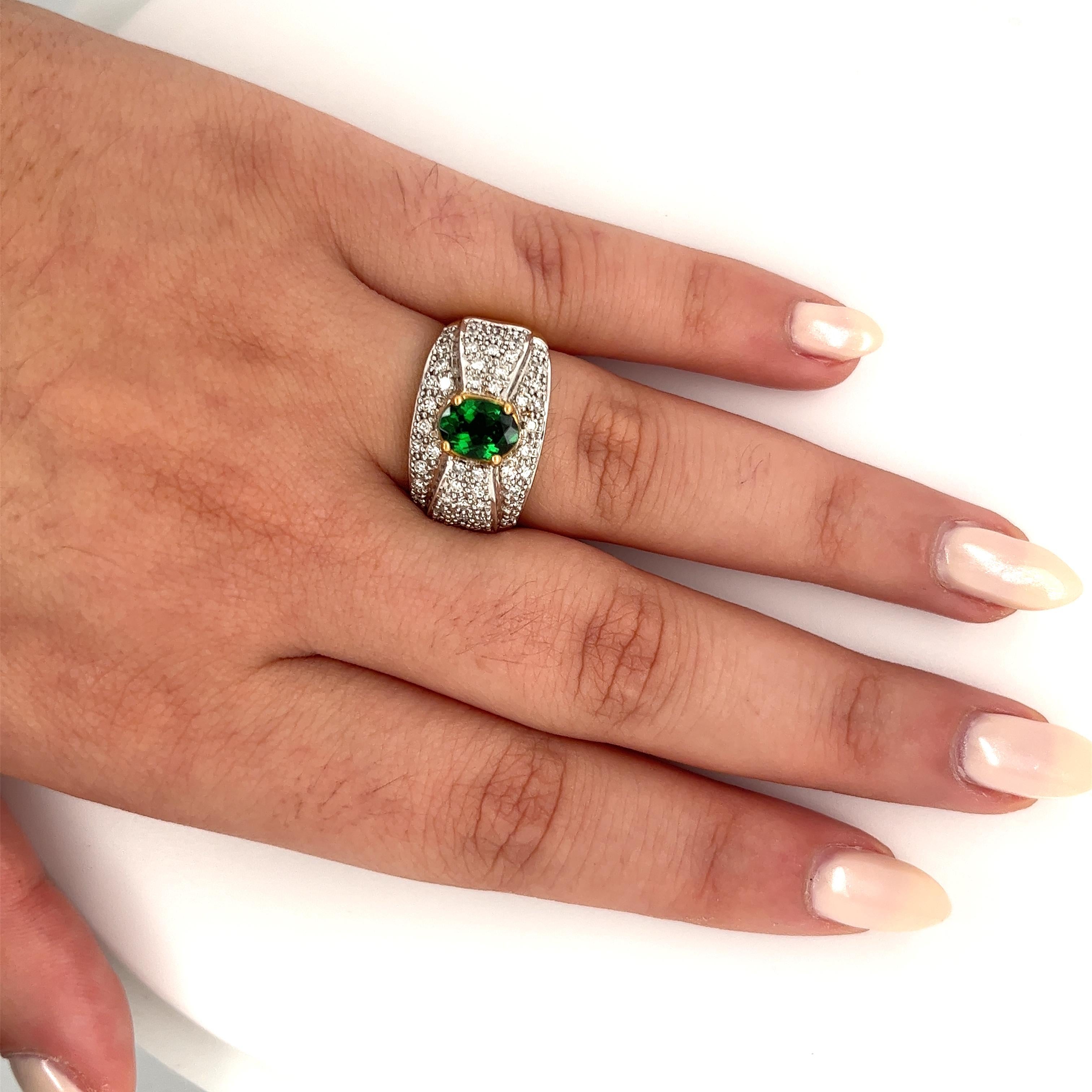 Art Deco Vintage 1.50 Carat Oval Cut Green Tsavorite and Diamond Cluster Ring For Sale