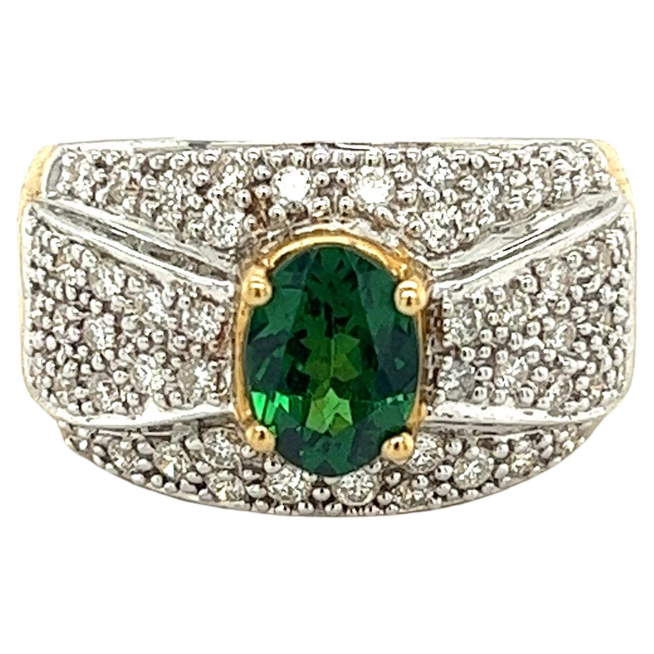 Vintage 1.50 Carat Oval Cut Green Tsavorite and Diamond Cluster Ring For Sale