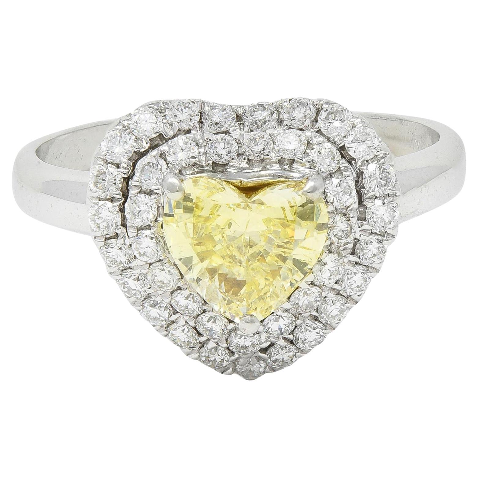 Vintage 1.50 CTW Fancy Light Yellow Heart Diamond 18 Karat Gold Halo Ring GIA For Sale