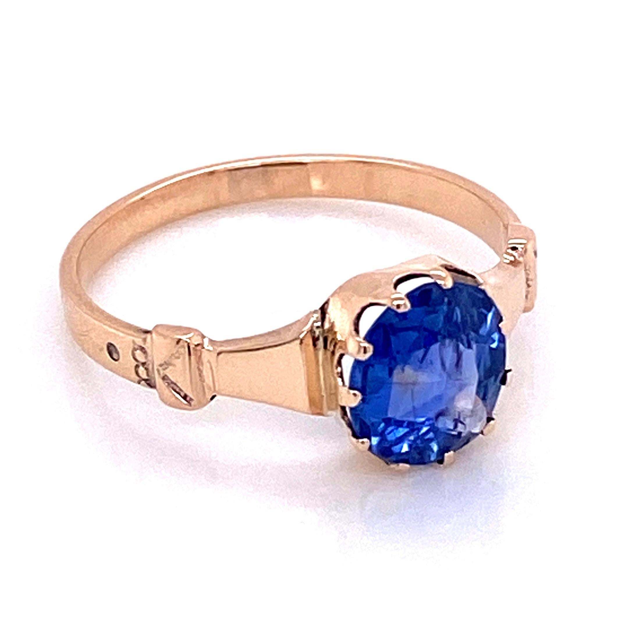 Simply Beautiful! Finely detailed Blue Sapphire Ring. Centering a securely nestled Hand set 1.51 Carat NO HEAT Blue Sapphire. The Sapphire has intact crystal inclusions indicating it has no evidence of heat treatment. Hand crafted 9 Carat yellow