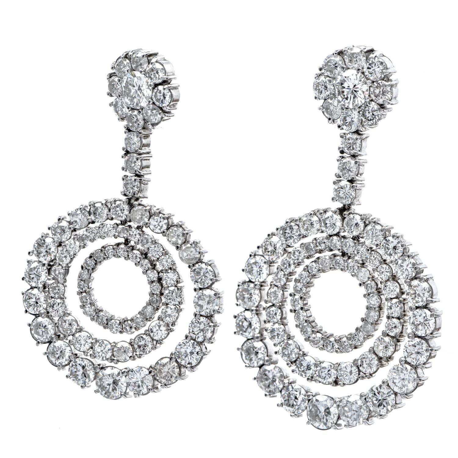 This Vintage. earrings with an Art deco design, are from circa the 1960s and display a Circular Drop design.

Completely covered in diamonds, prong set, with 126 round Genuine diamonds, weighing in a total of 15.20 carats, G-H color &