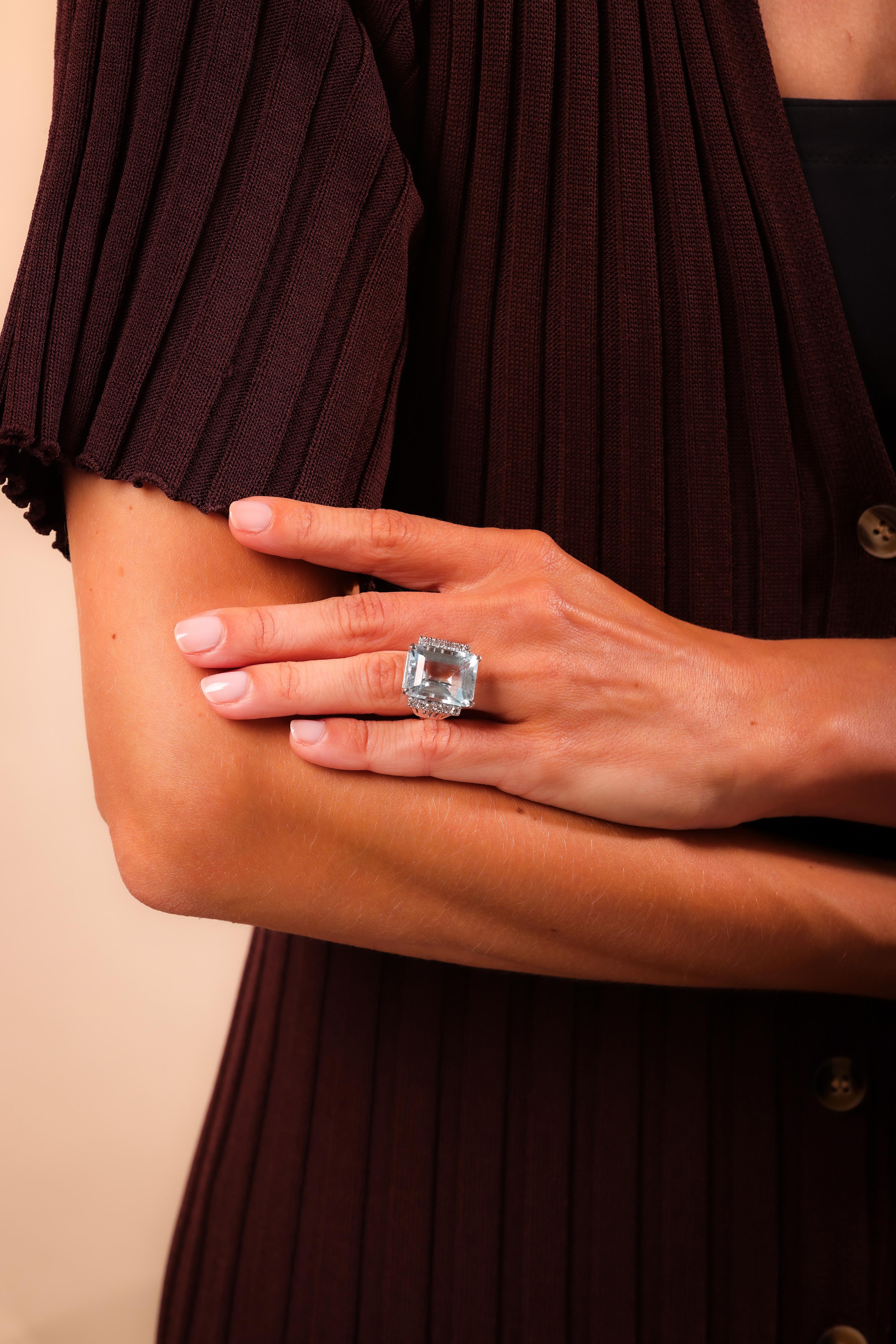 Center Stone: Emerald Cut Aquamarine
Weight: Approximately 15.3 Carat
Accent Stone: 12 Single Cut Diamonds
Weight: Approximately .20 Carats
Color: H
Clarity: VS
Metal: 14K White Gold
Era: Vintage
Circa: 1980's
Hallmarks: Purity Marks and