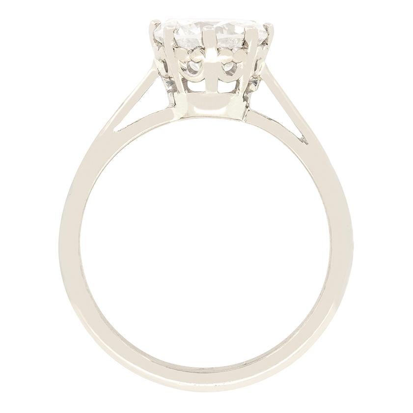 Classic in it’s design, this vintage solitaire is the quintessential engagement ring. A 1.53 carat round brilliant stone sits at it’s heart, with a colour of G and a clarity of SI2. The diamond is firmly claw set into a beautifully decorative collet
