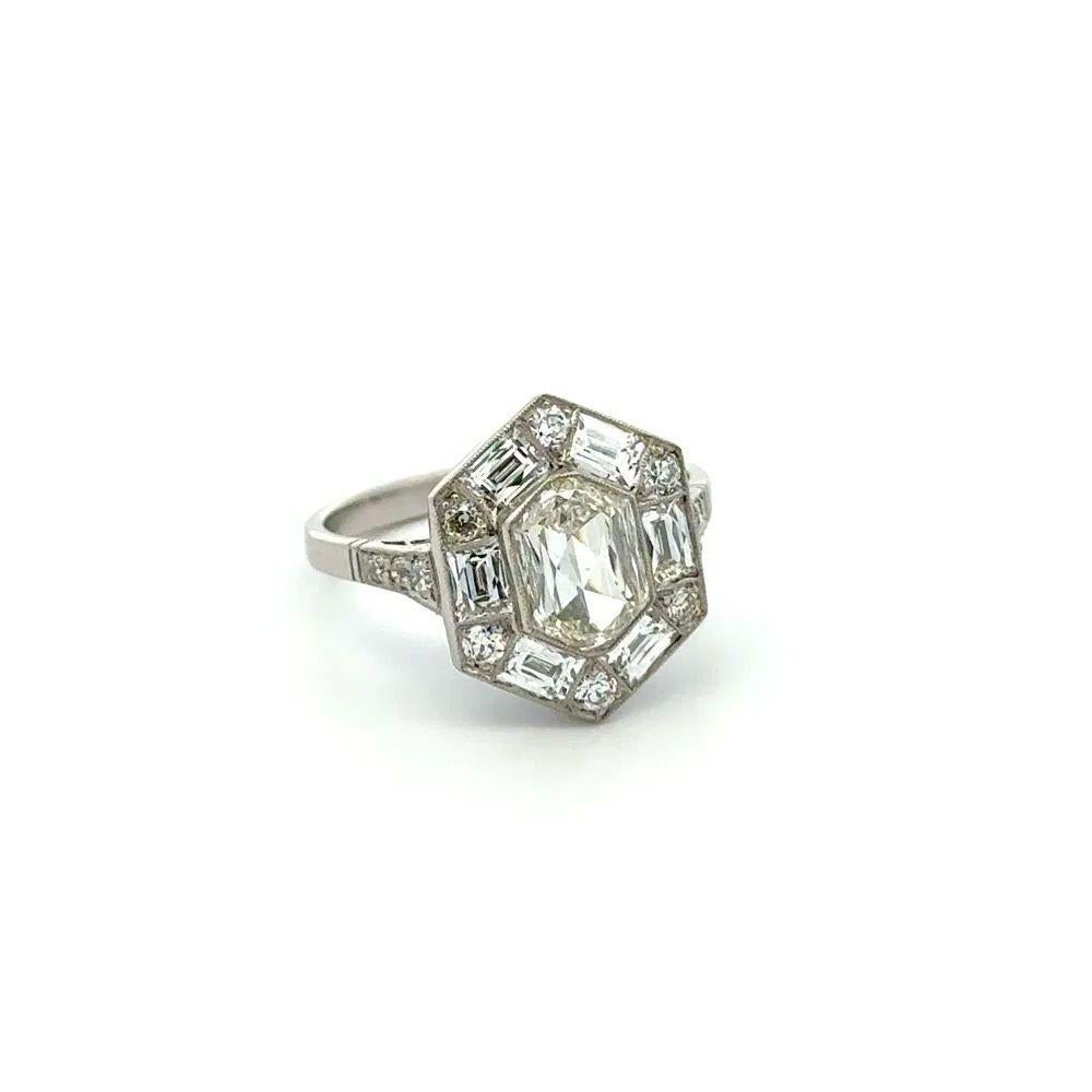 Simply Beautiful! Octagonal Diamond GIA Platinum Solitaire Vintage Ring. This exquisitely crafted ring features a securely nestled Hand set 1.54 Carat Octagonal Diamond, GIA Quality I-VS2. Surrounded and accented on shank by 1.33tcw French Cut and