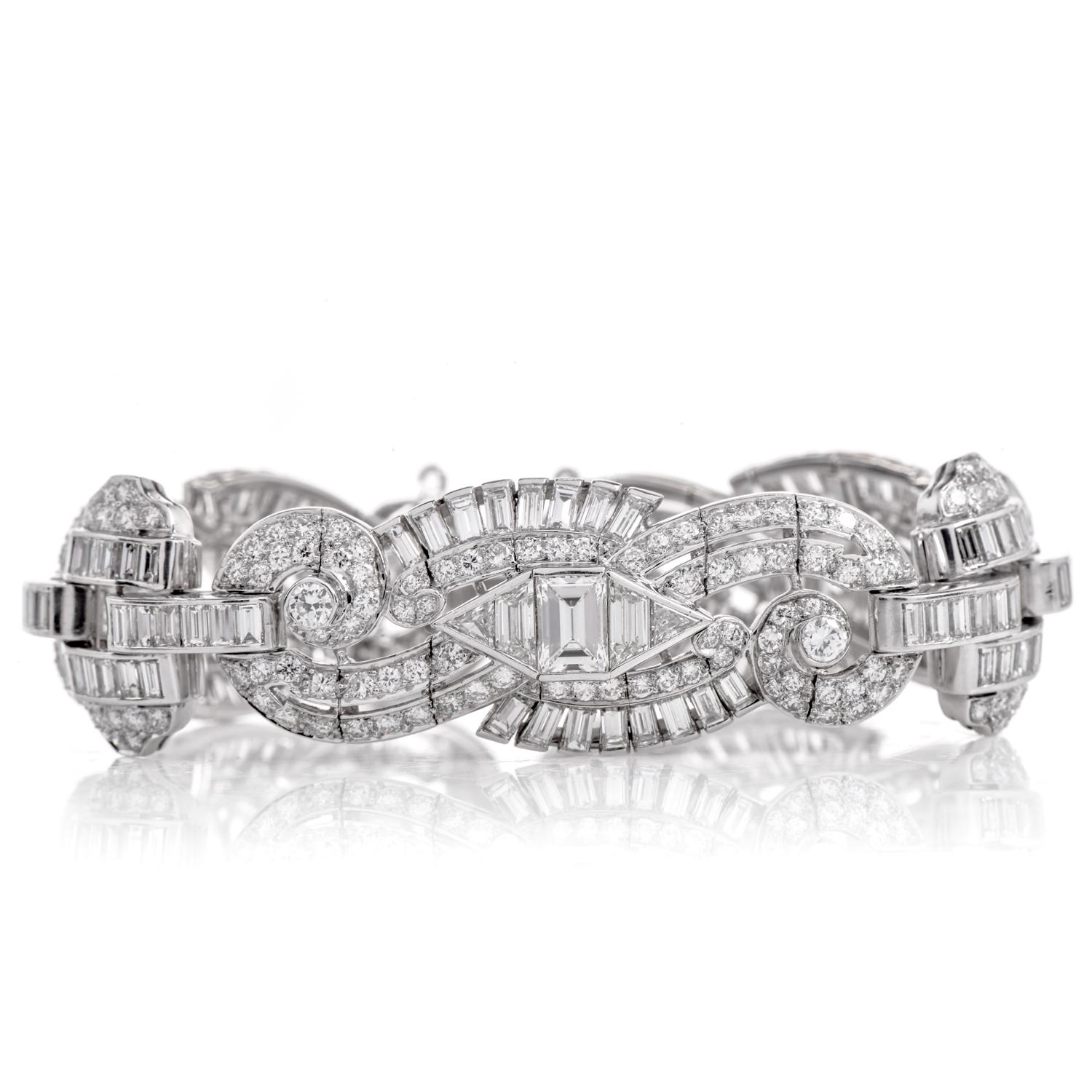This exquisite sparkly emerald and Round-cut Diamond Bracelet was crafted in luxurious Platinum. 

The vintage platinum bracelet is completely covered in Diamonds with three graduated sections of emerald, round, and triangular shapes Genuine natural