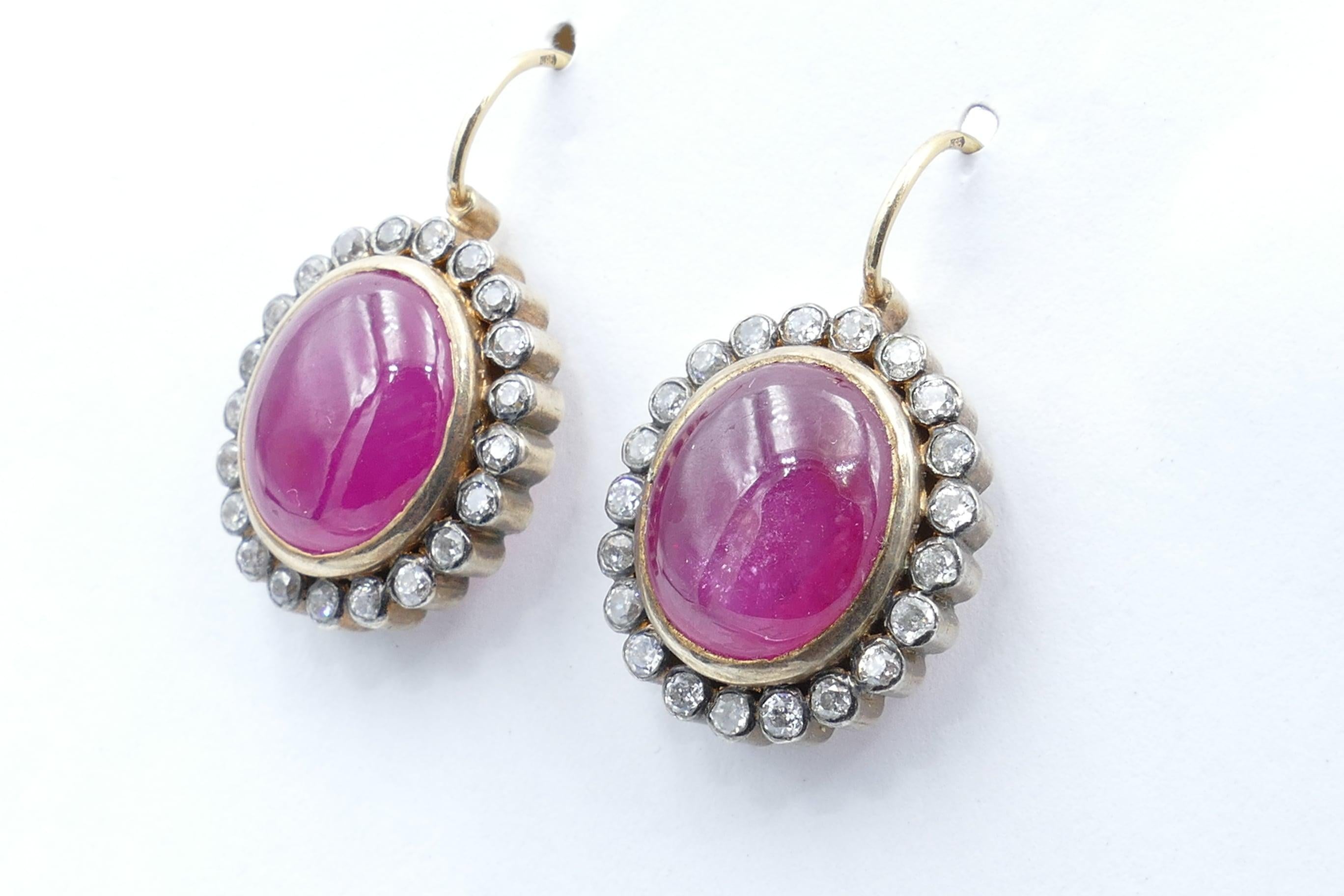 Manufactured in London these are a very arresting pair of 15 Carat Yellow Gold Vintage Ruby earrings. There has been some colour Enhancement of the Ruby stone but actually this only adds to the appeal and certainly is reflected in the extremely good