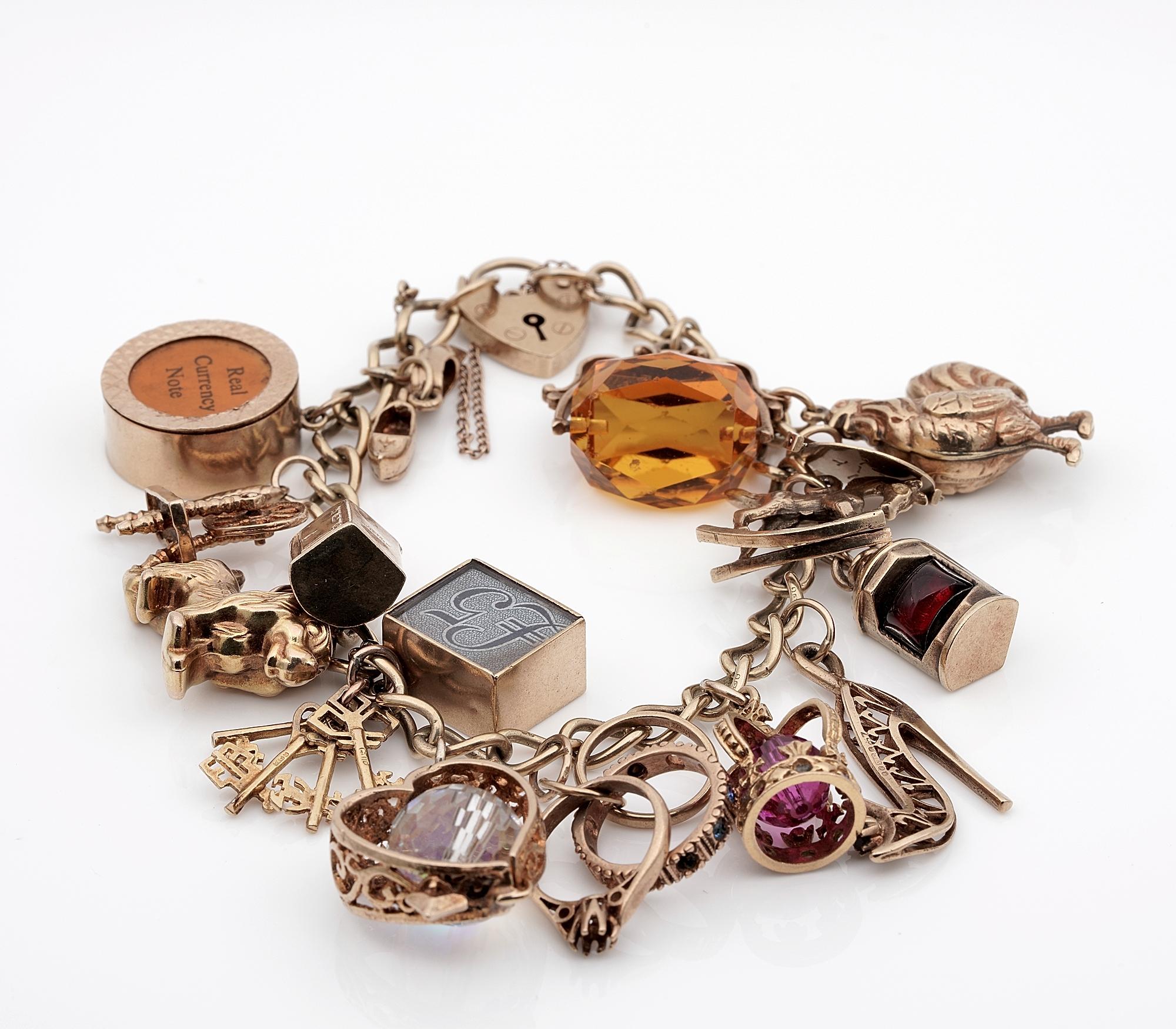 Collecting Fun from 20's to 40's

English origin vintage charm bracelet all crafted of solid 9 ct gold, hallmarked
Comprising a heart padlock bracelet loaded with 16 charms varying in age as added along the time
Charms include a dog, a cockerel, a