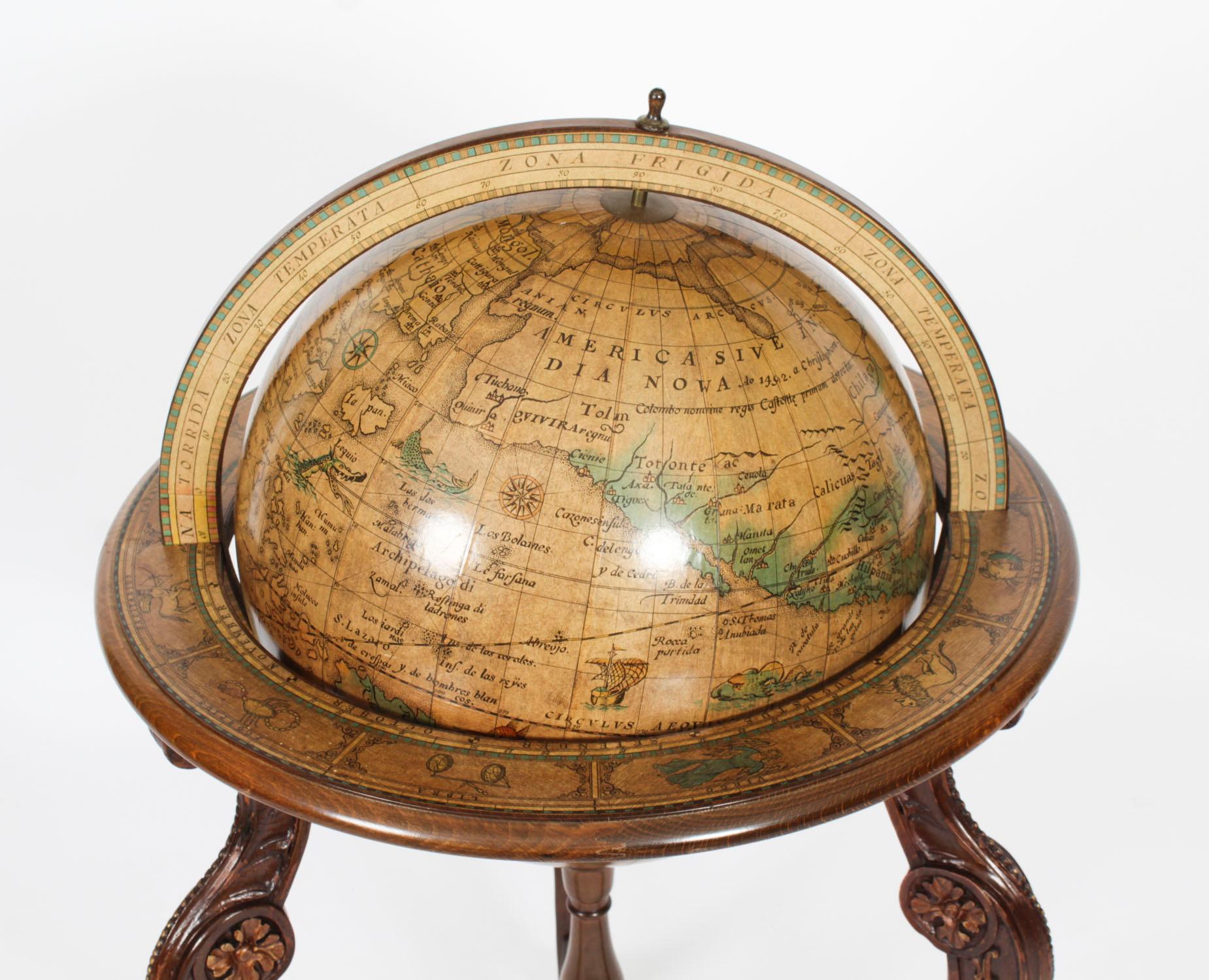 A fine vintage 16 inch walnut and gilded terrestrial library globe on stand by Donati, Milano, Italy,  Circa 1960 in date.

The stunning globe is in 17th Century style, is written entirely in Latin and is raised on a highly decorative walnut and
