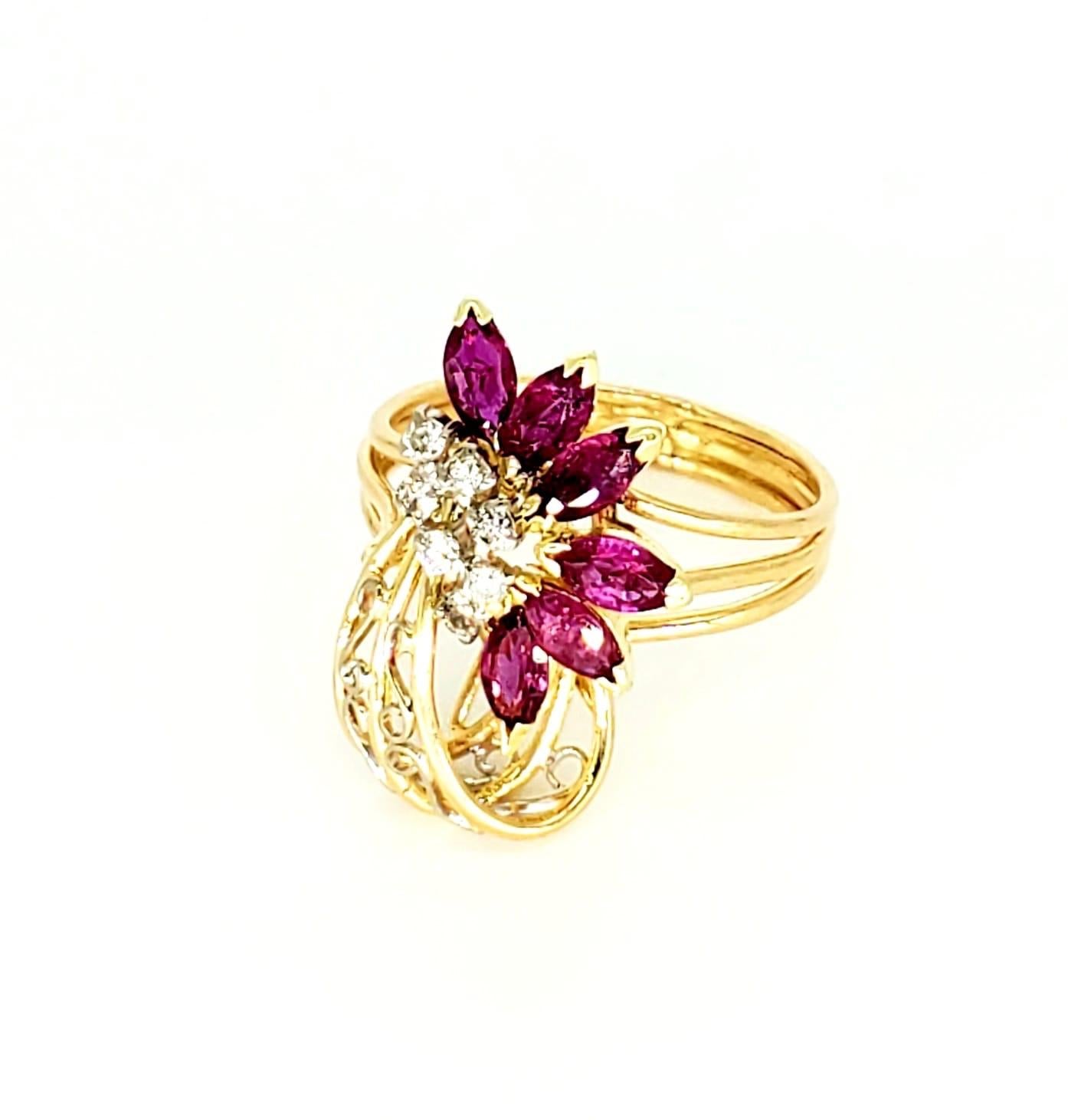 Vintage 1.60 Carat Ruby & Diamond Flower Cocktail Ring. The ring features marquise Ruby’s weighting approx 1.50 carat and round diamonds weighing approx 0.10 carat. The ring is beautifully handcrafted to perfection with very precise details making