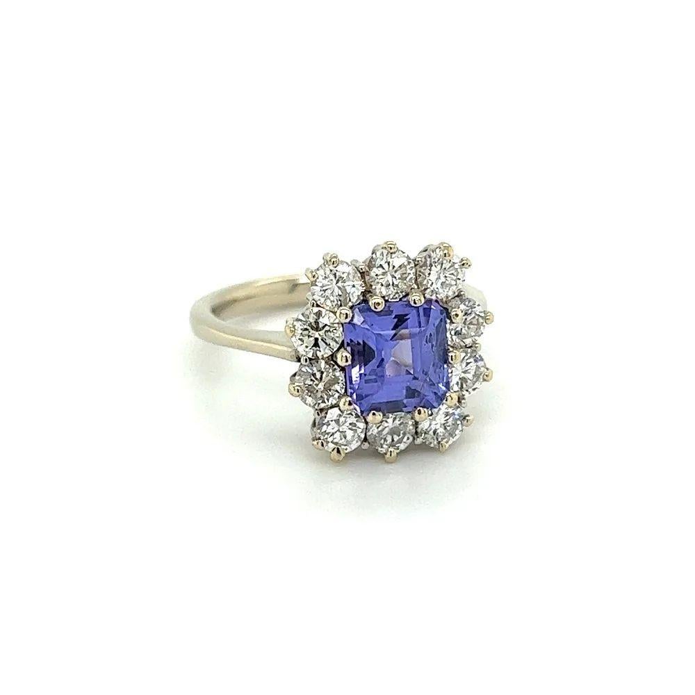 Simply Beautiful! Finely detailed 1.60 Carat Square Emerald Cut Tanzanite and Diamond Cocktail Ring. Centering a securely Hand set Square Emerald Cut Tanzanite weighing approx. 1.60 Carat surrounded by 10 Round Brilliant Diamonds, weighing approx.