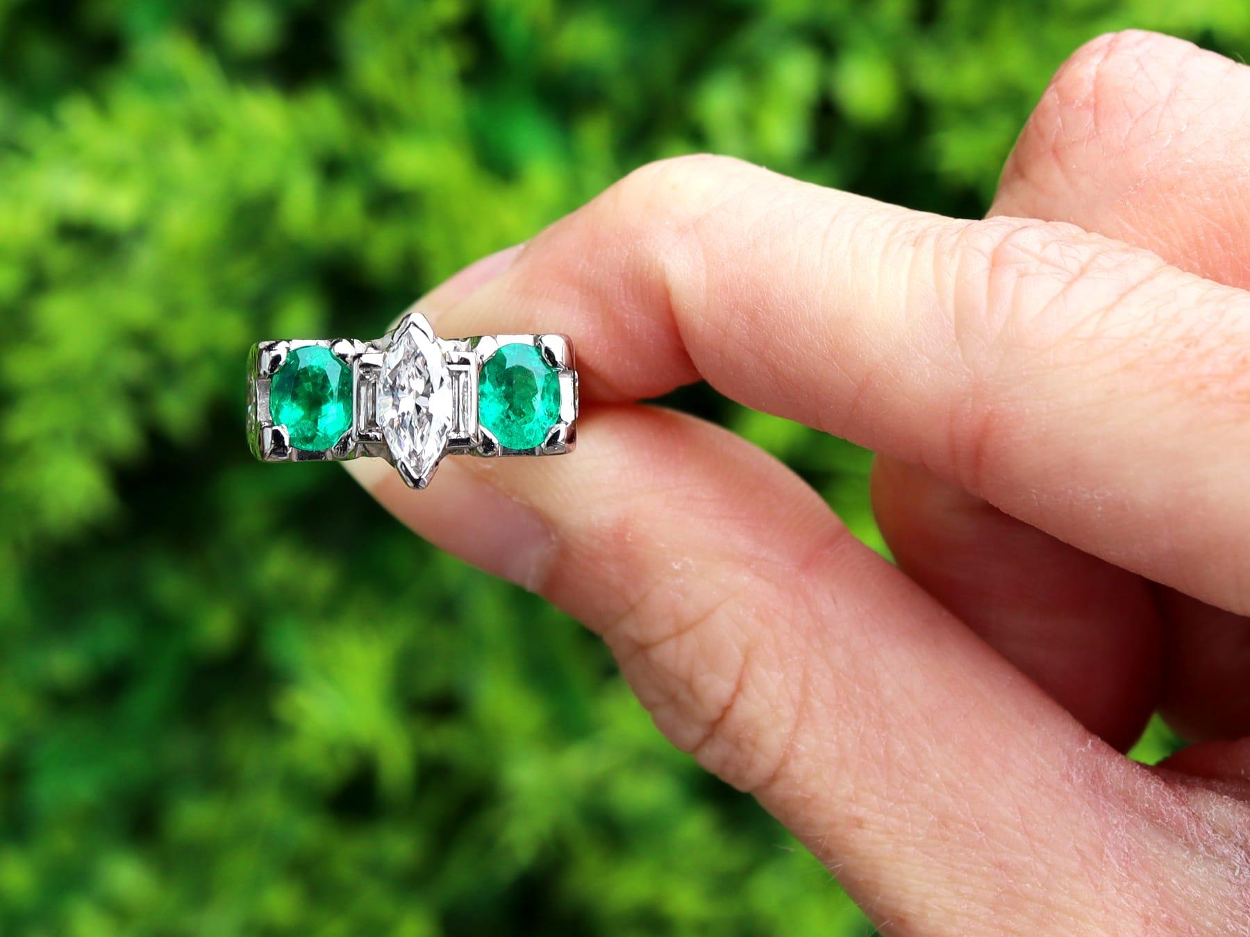This stunning, fine and impressive vintage emerald and diamond ring has been crafted in platinum.

The rectangular, subtly stepped design is ornamented with a feature 1.15ct marquise cut diamond, claw set in relief to the center.

The diamond is