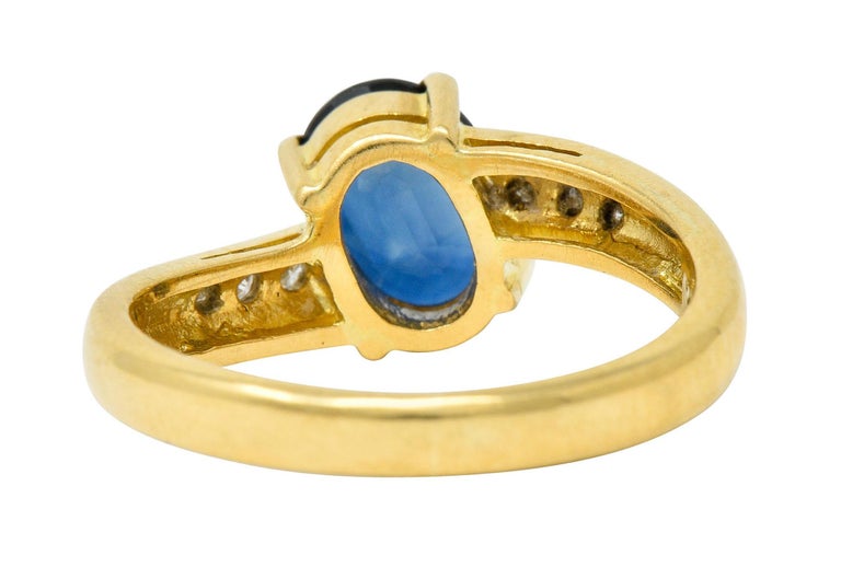 Oval Cut Vintage 1.61 Carat Sapphire Diamond 18 Karat Gold Bypass Ring For Sale
