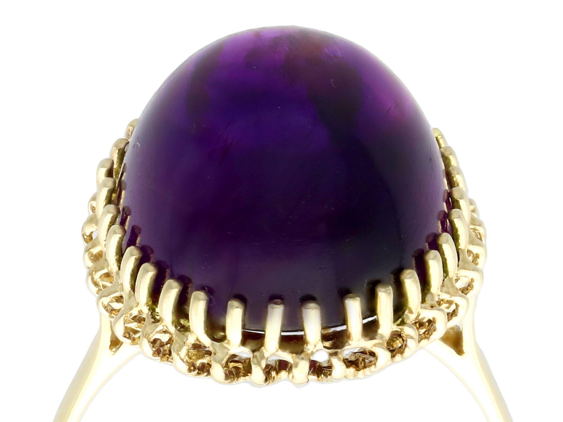 A fine and impressive vintage 12.88 carat amethyst and 14 karat yellow gold cocktail ring; part of our diverse vintage gemstone jewelry and estate jewelry collections.

This fine and impressive cabochon cut amethyst ring has been crafted in 14k