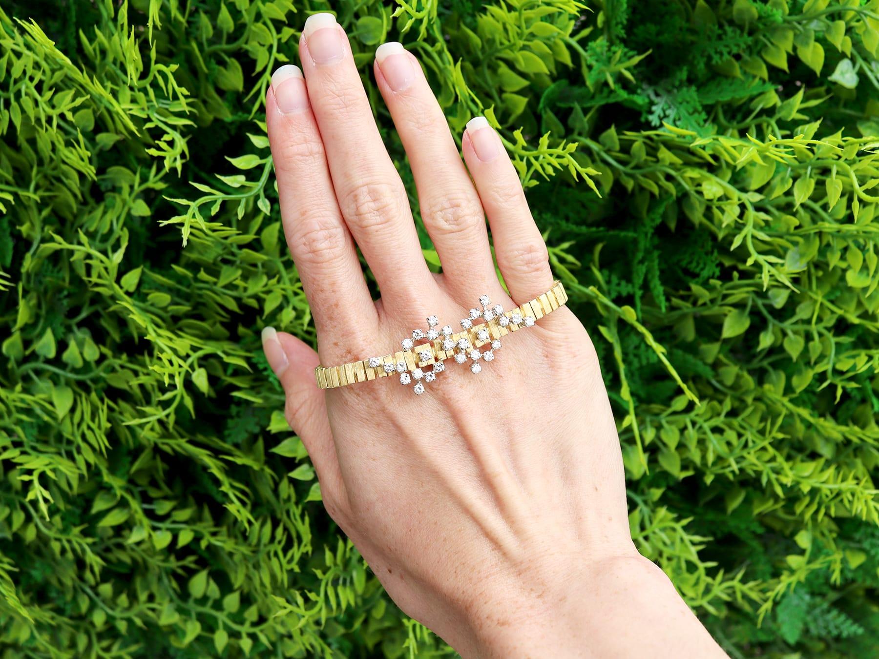 A fine and impressive vintage 1.65 carat diamond and 18 karat yellow gold, 18 karat white gold set abstract bracelet; part of our vintage diamond jewelry collection.

This fine and impressive vintage diamond bracelet has been crafted in 18k yellow