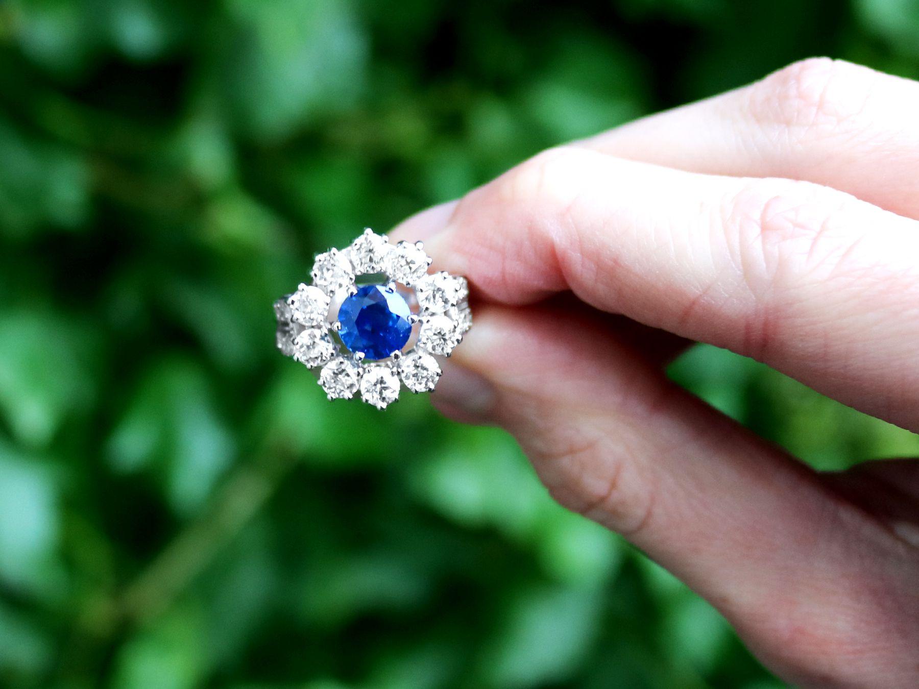 A stunning, fine and impressive 1.66 carat sapphire and 1.90 carat diamond platinum cluster ring; part of our diverse antique jewelry and estate jewelry collections.

This stunning and impressive vintage sapphire and diamond cluster ring has been