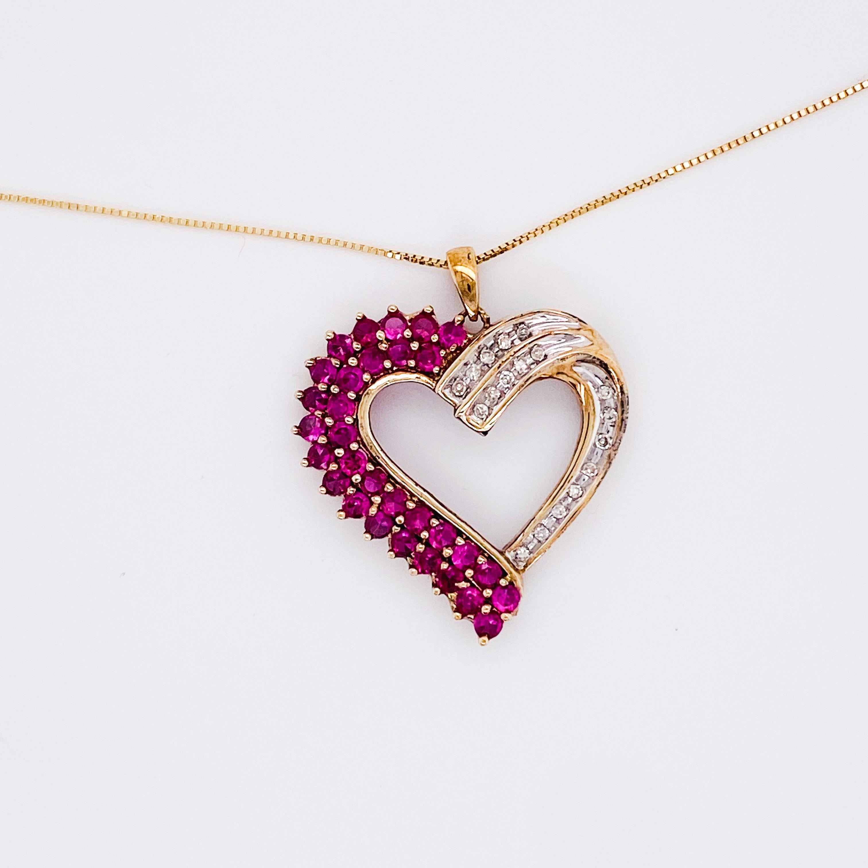 This gorgeous vintage heart pendant shows off your sweeping romance. The double row of pink-red rubies are protected by the prongs that nestle them tight and close. The accent diamonds sweep around the other half of the heart protected in curving