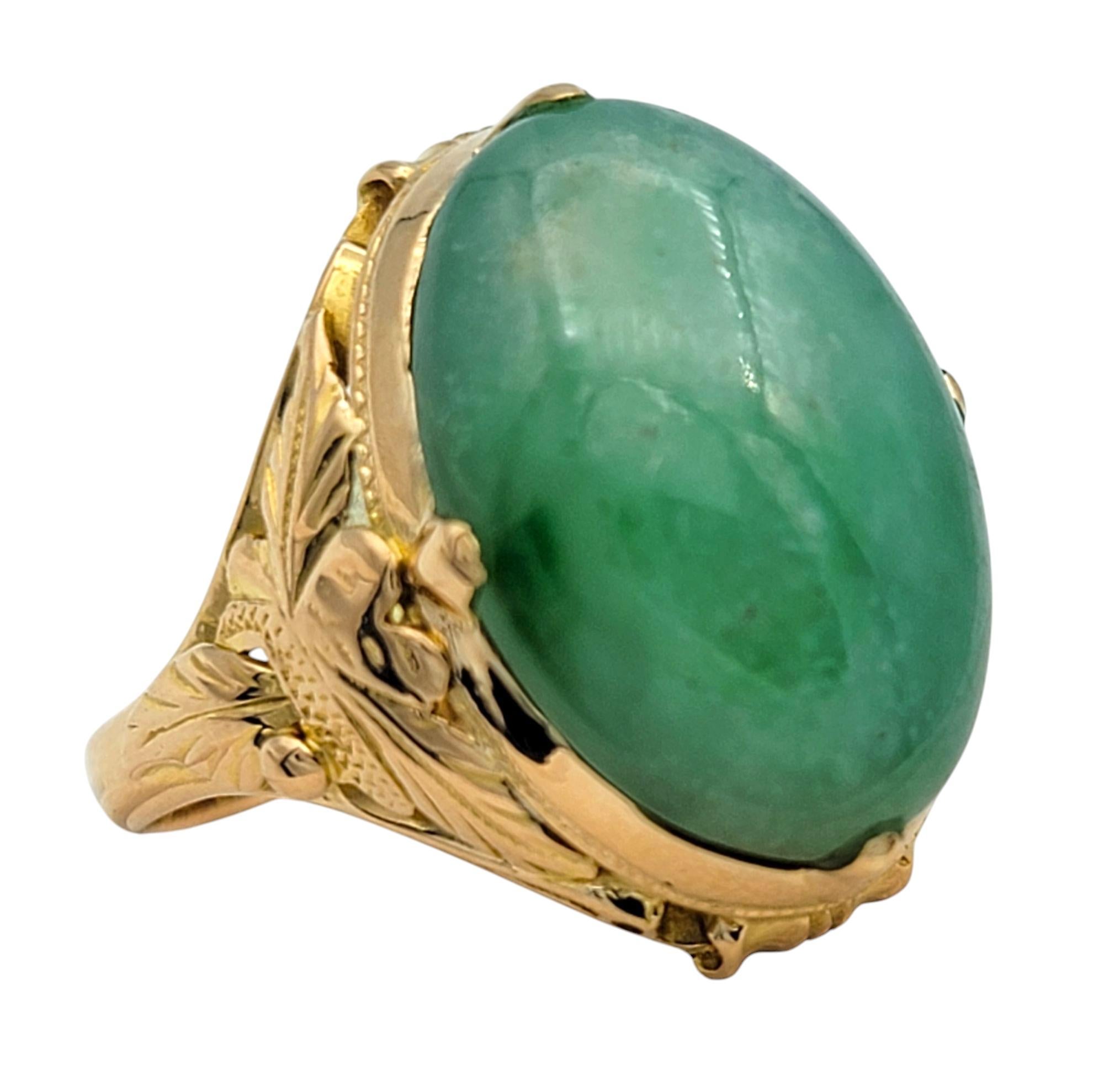 Contemporary Vintage 16.76 Carat Oval Cabochon Jade Cocktail Ring in 20 Karat Yellow Gold For Sale
