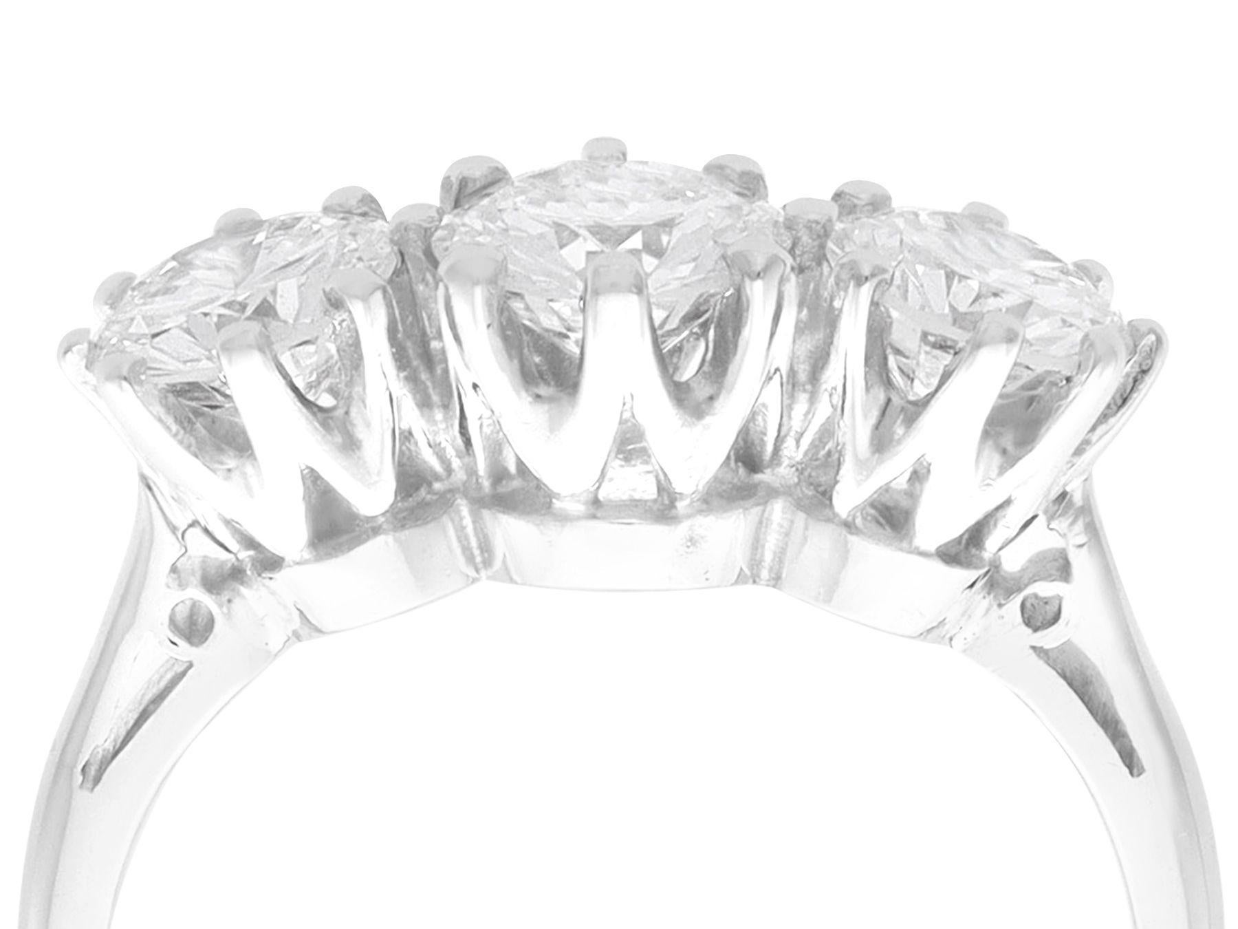 A stunning, fine and impressive vintage 1.67 carat diamond and platinum trilogy dress ring; part of our diverse vintage jewelry and estate jewelry collections

This stunning vintage trilogy diamond ring has been crafted in platinum.

The pierced
