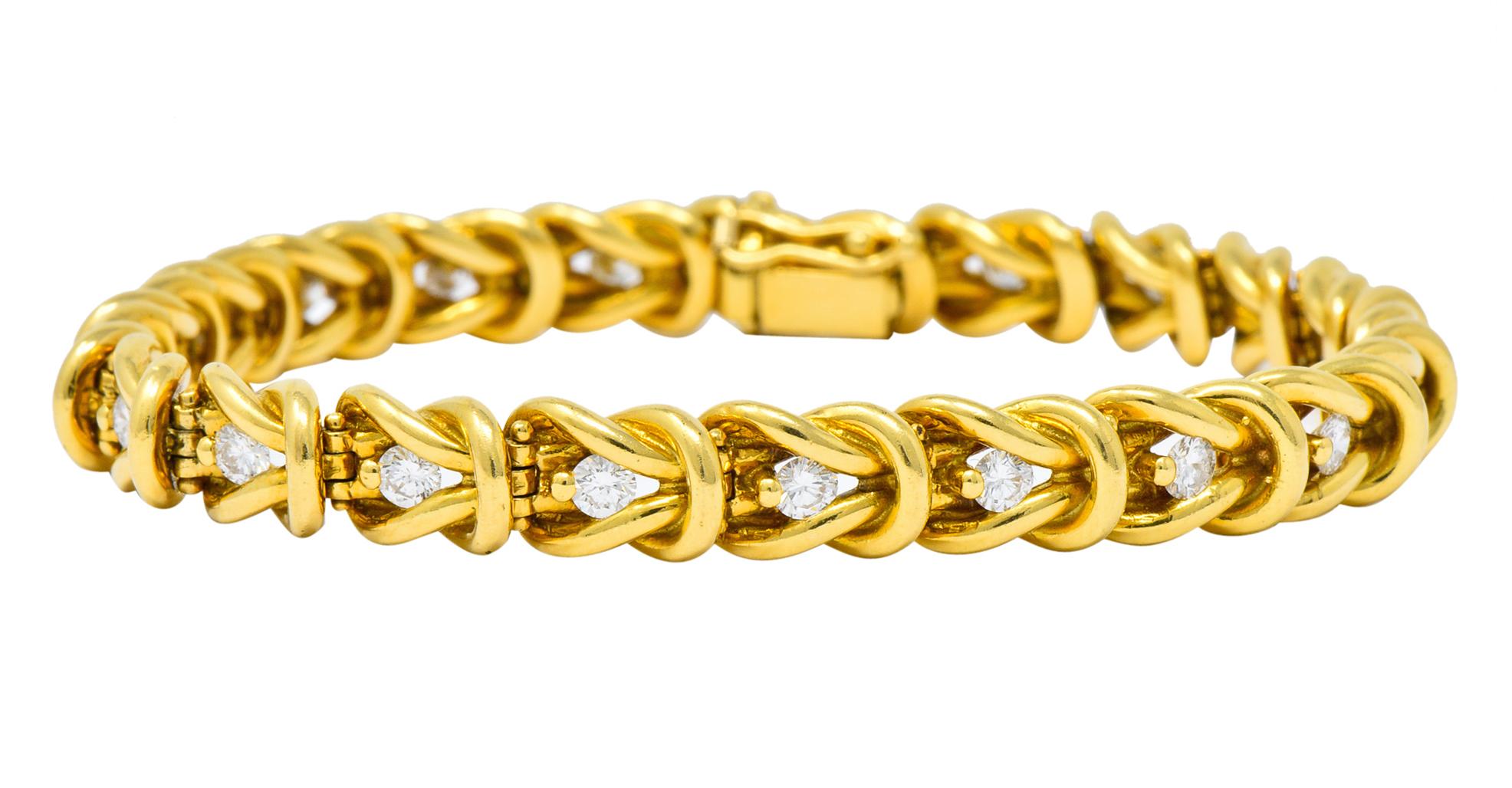 Link style bracelet featuring a repetitious polished gold sailor's reef knot loop motif

Set throughout with round brilliant cut diamonds weighing approximately 1.68 carats total, H/I color and VS clarity

Completed by concealed clasp with figure