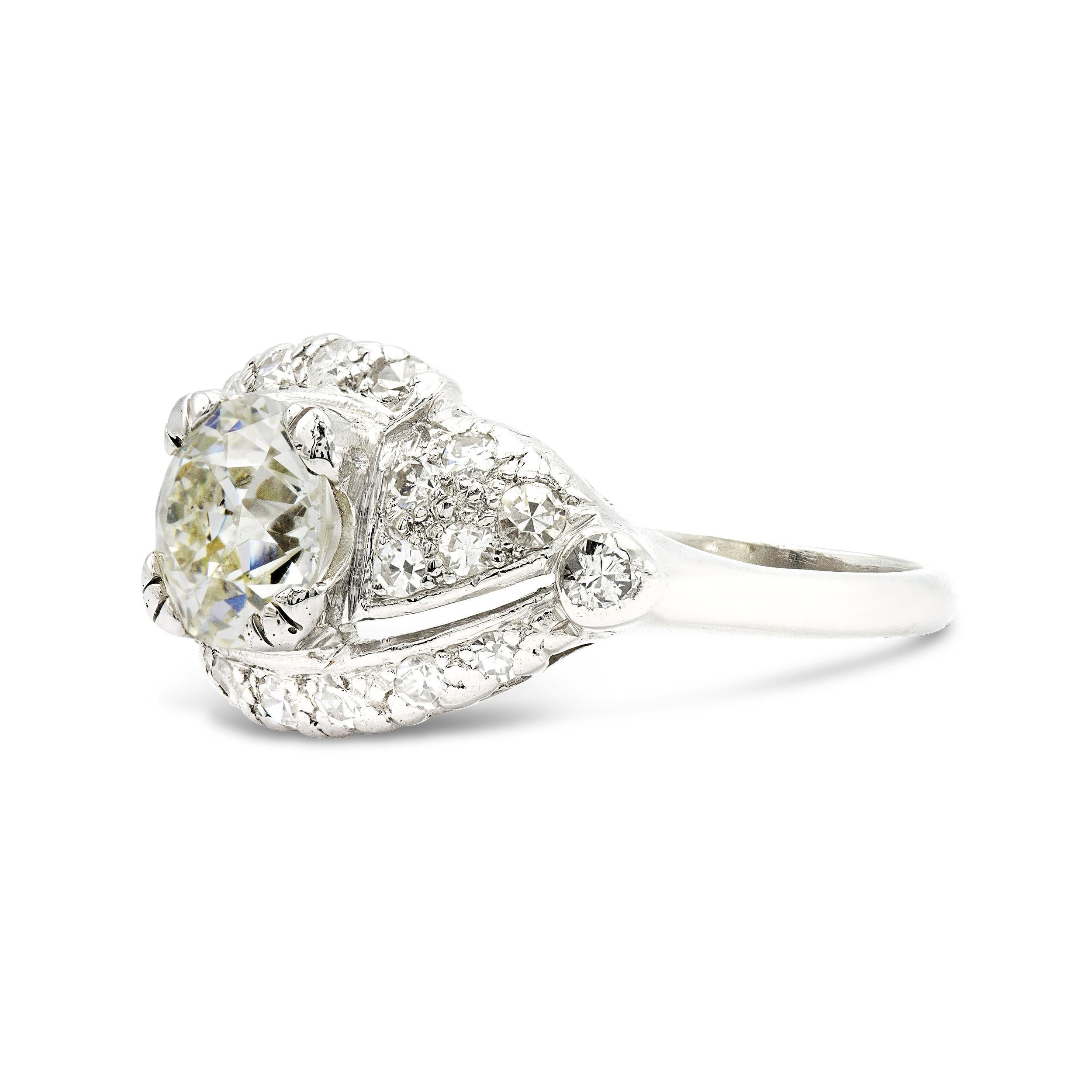 Here's a unique ring that would be hard to miss. A sea of bead set diamonds shimmer from this ring, with a 1.45 ct. old European diamond at its center. This ring offers some serious finger coverage and is the perfect choice for a woman looking for