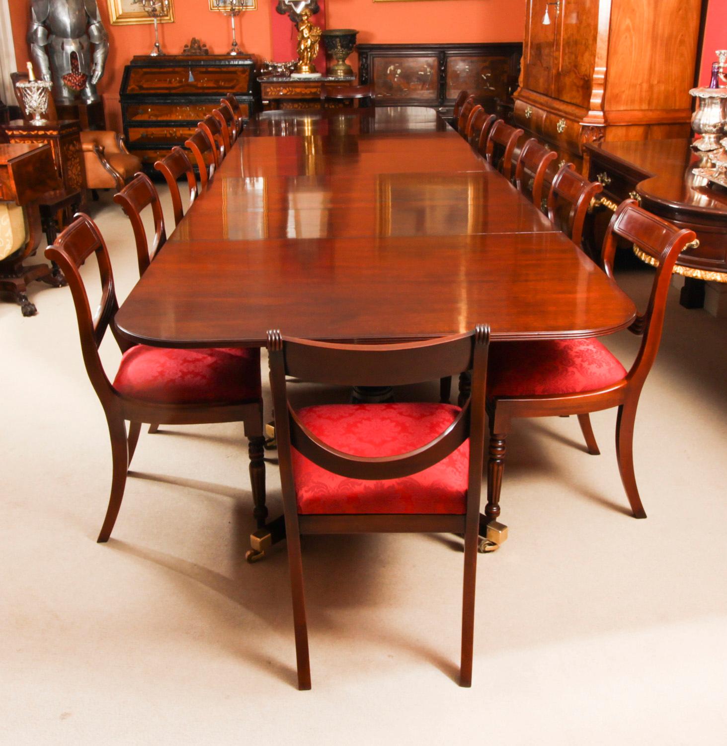 This is a fabulous Vintage dining set comprising a Regency Revival dining table by William Tillman and a set of sixteen swag back dining chairs, Circa 1980 in date.

The table is made of stunning solid flame mahogany and is raised on four 