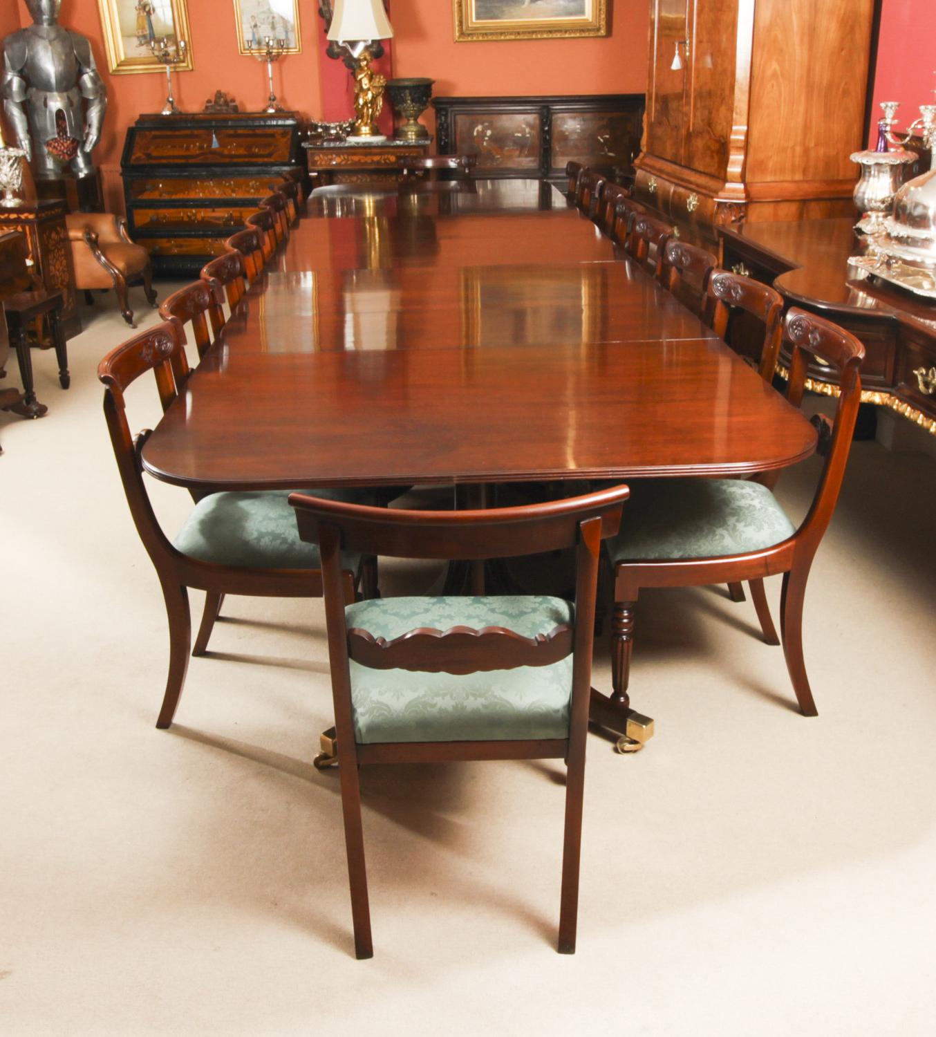 This is fabulous Vintage dining set comprising a Regency Revival dining table by the master cabinet maker William Tillman, and a set of eighteen Regency Revival bar back dining chairs, Circa 1980 in date.

The table is made of stunning solid flame