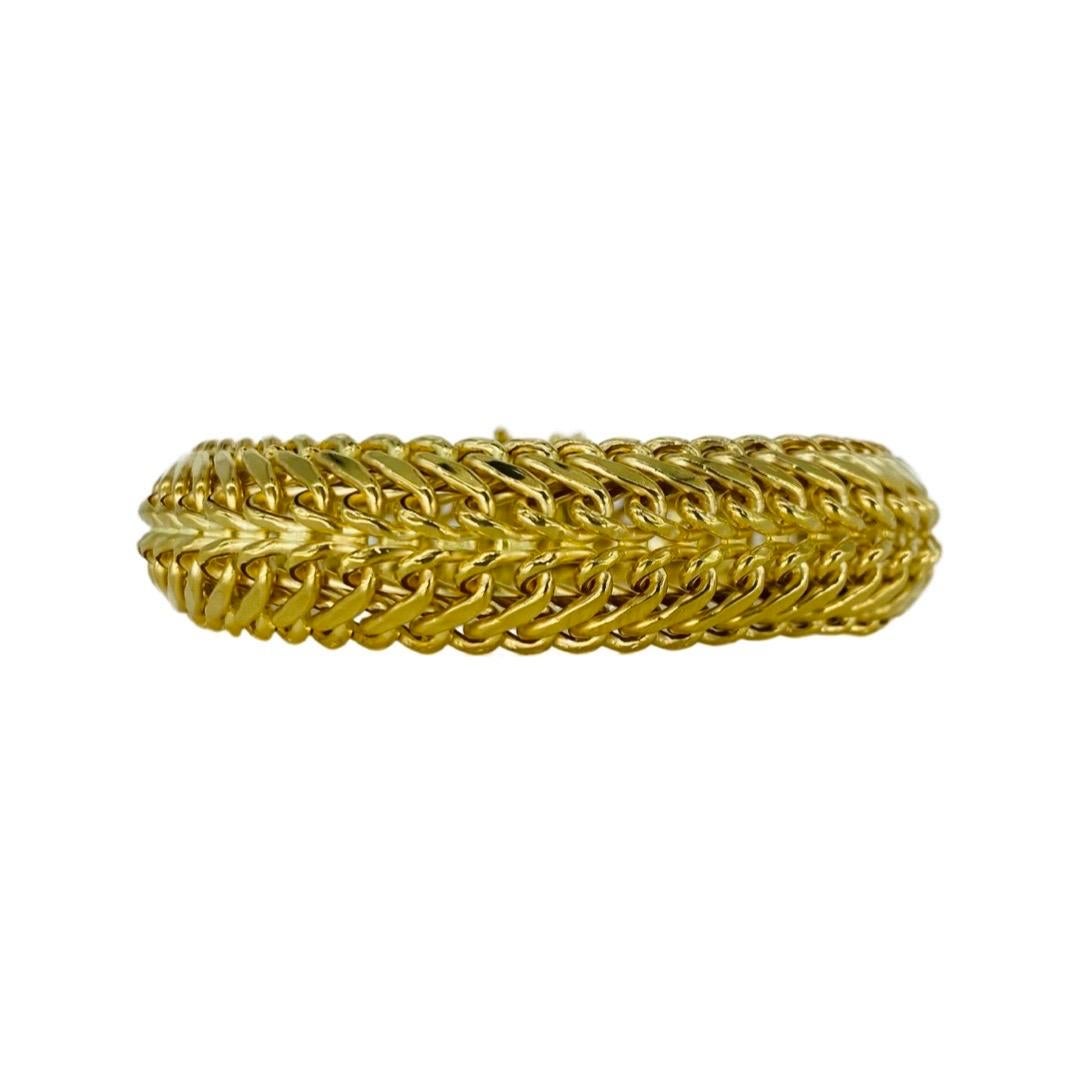 Vintage 16mm Woven Swirl Bracelet 18 Karat Gold 7.5 Inch. Beautiful and elegant bracelet to go with any outfit. The bracelet is bold and stands out in the crowd. The bracelet weights 22.7 grams and is stamped 750 for gold purity.