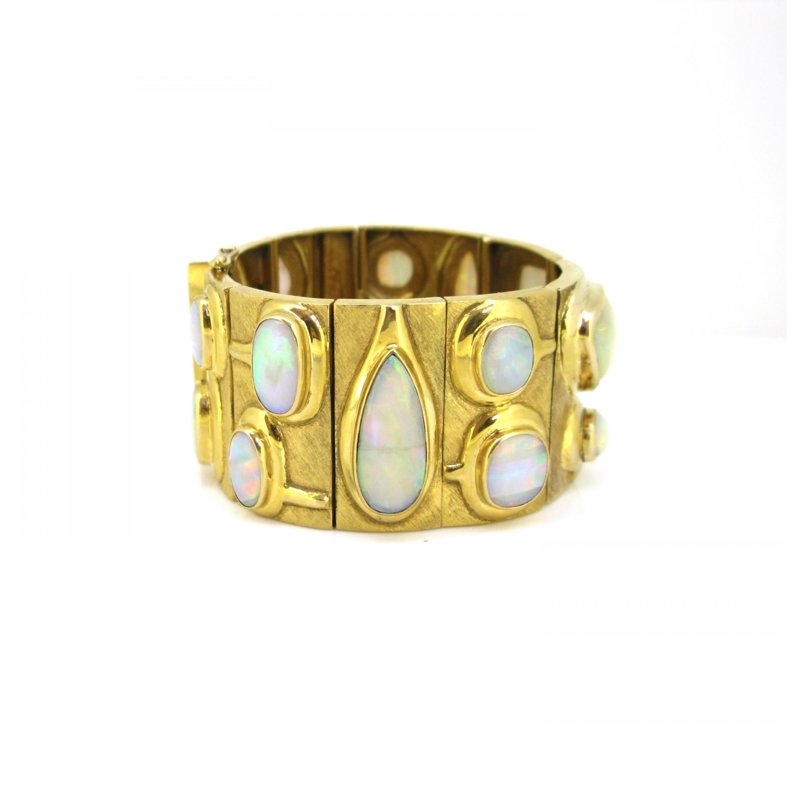 Weight:	116gr


Metal:	18kt yellow gold

	
Condition:	Very Good


Stones:	17 White Opals
•	Total carat weight:	55ct approximately

Signature:	Burle Marx


Comments: 	This important bracelet comprises 9 plaques of 18kt brushed yellow gold (tested).