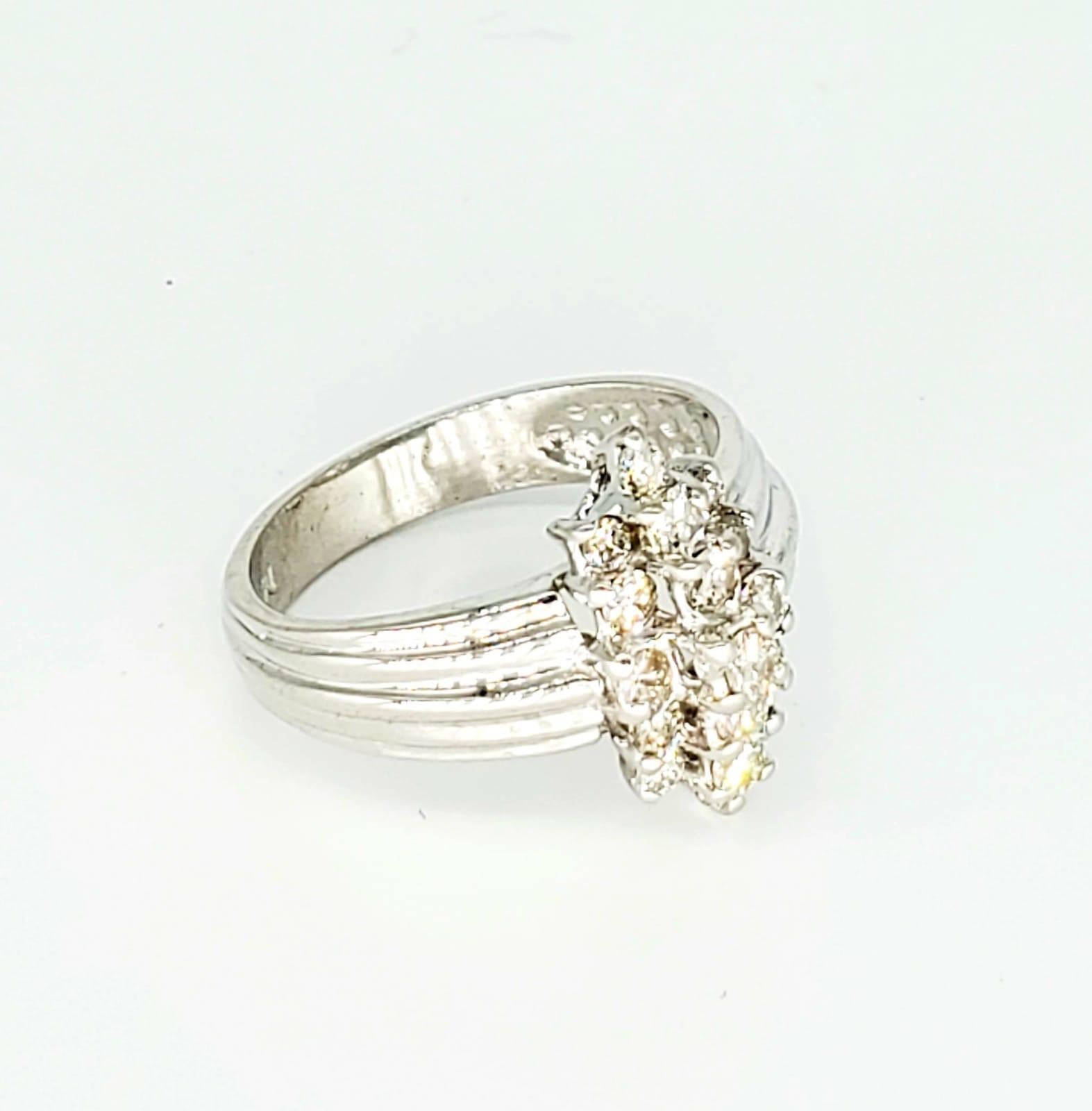 Vintage 1.70 Carat Diamonds Cluster Ring 14k White Gold. The ring is a size 8 and weights 4.9 grams.