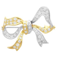 Spilla a fiocco in oro bicolore con diamante 1,70ct vintage