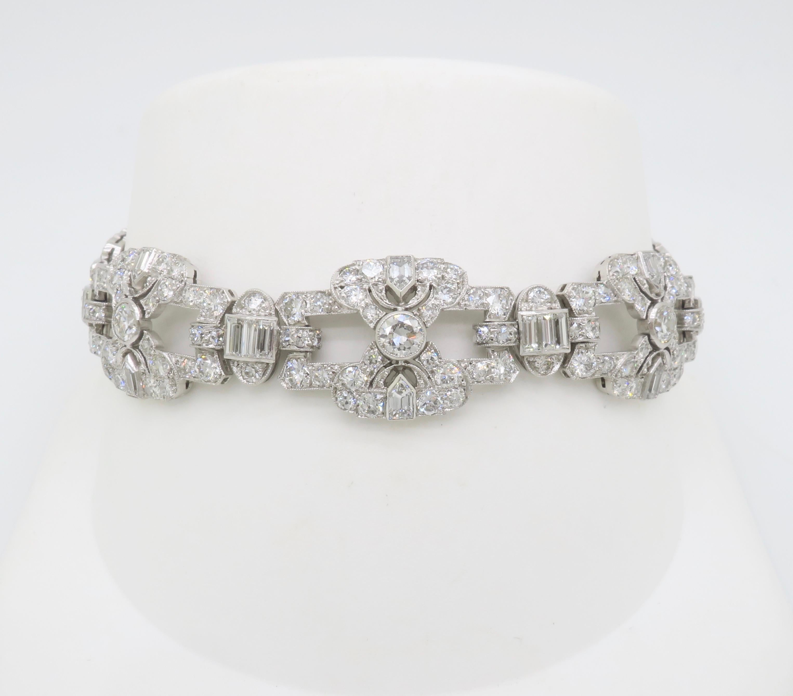 Stunning hand fabricated Platinum vintage bracelet encrusted with 17.26CTW of diamonds. 

Gemstone: Earth Mined Diamond
Diamond Carat Weight: 17.26CTW 
Diamond Cut: Transitional Round, Baguette, Shield Baguette Cut 
Color: E-G
Clarity: