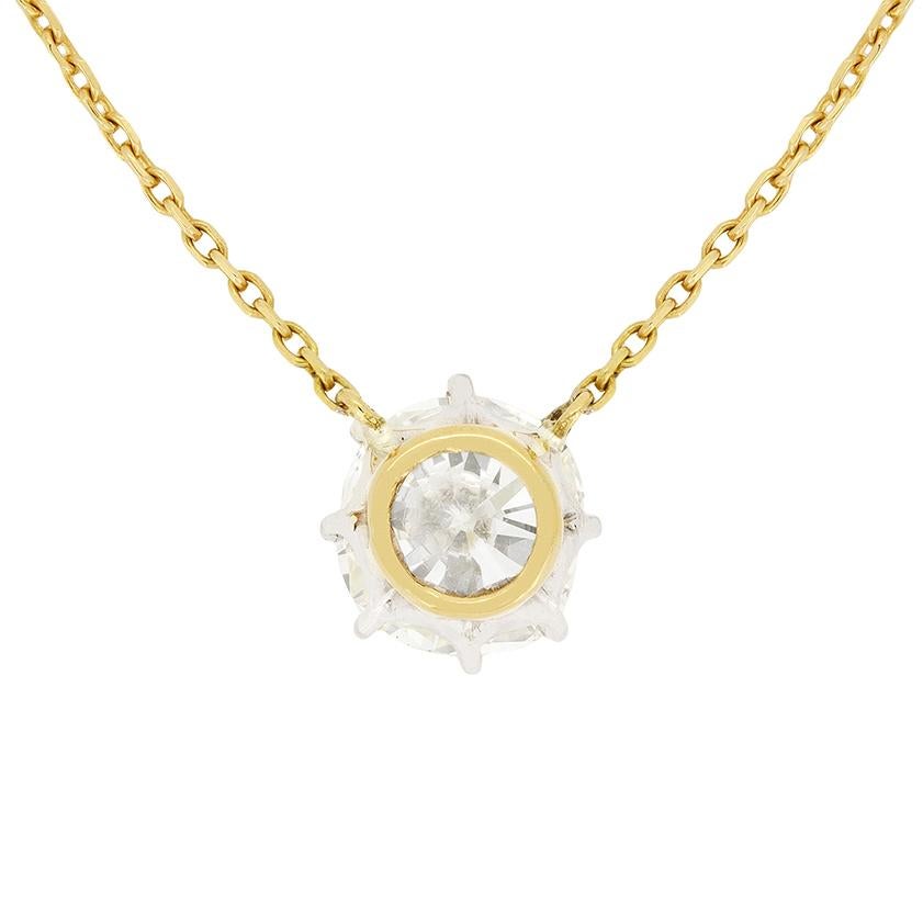 Simple yet elegant, a beautiful cushion cut diamond is star of the show in this 1950s pendant. The 1.72 carat diamond has been graded J in colour and VS1 in clarity, and is claw set within 18 carat white gold. Contrasting the whiteness of the