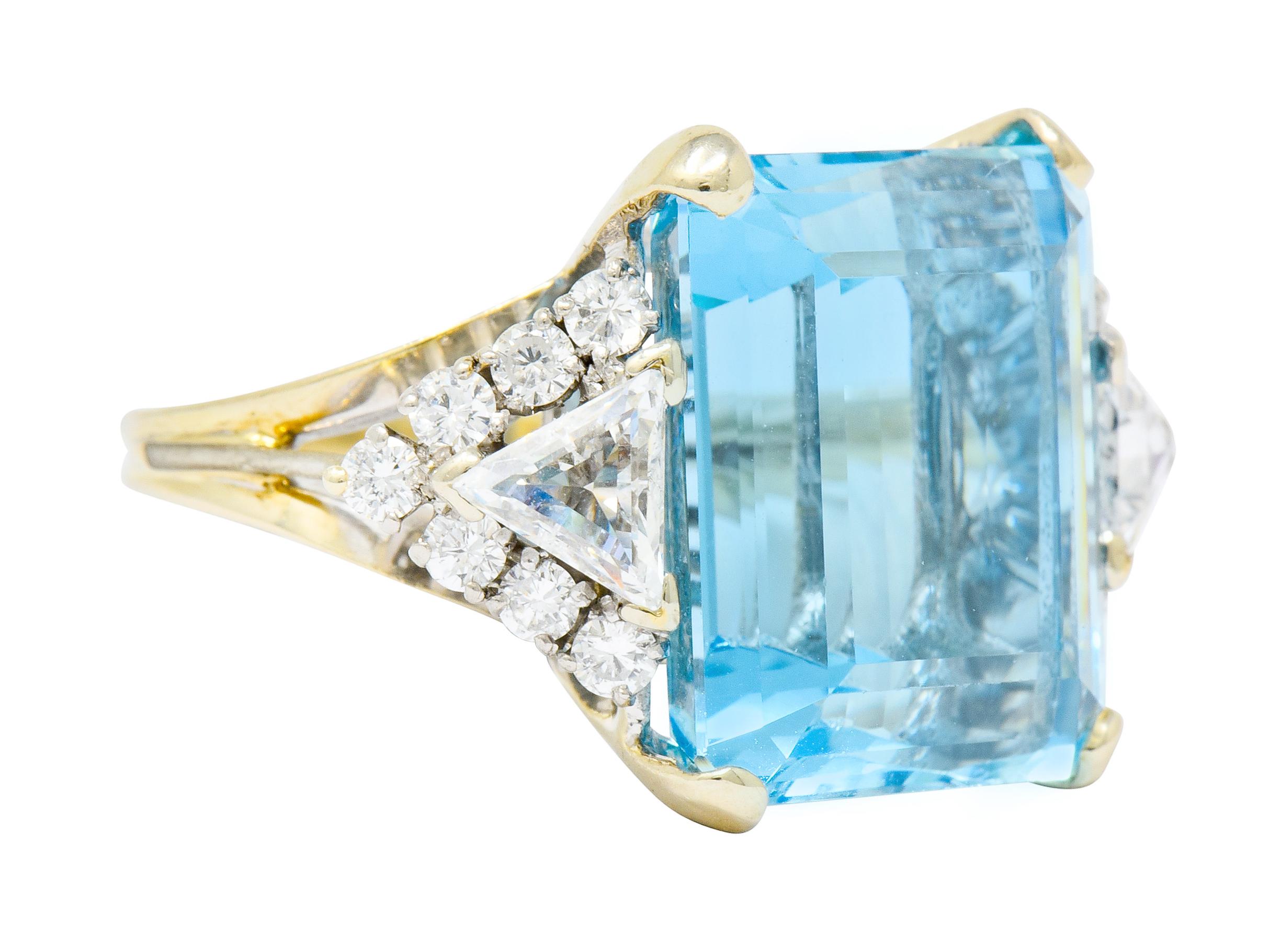 Centering a basket set rectangular step cut aquamarine weighing approximately 16.05 carats, transparent with strong sky blue color

Flanked by two trillion cut diamonds weighing approximately 0.60 carat total, H/I color with VS and SI clarity

Each