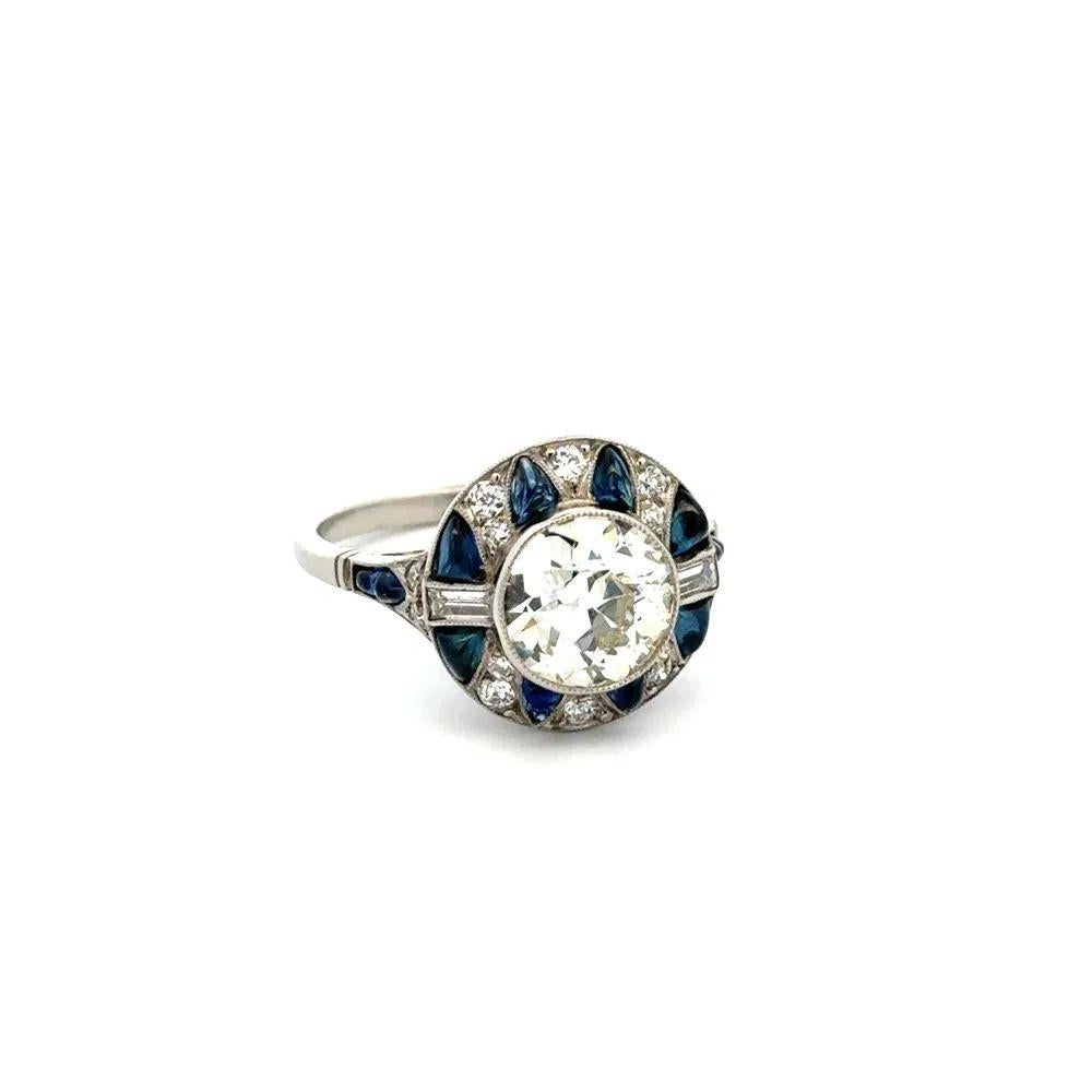 Simply Beautiful! OEC Diamond, surrounded by Buff Top Sapphires, Baguette and OEC Diamonds Platinum Cocktail Ring. Showcasing a securely nestled Hand set 1.75 Carat Old European Cut Diamond. Complimented by Buff-Top Sapphires, Baguette and Old