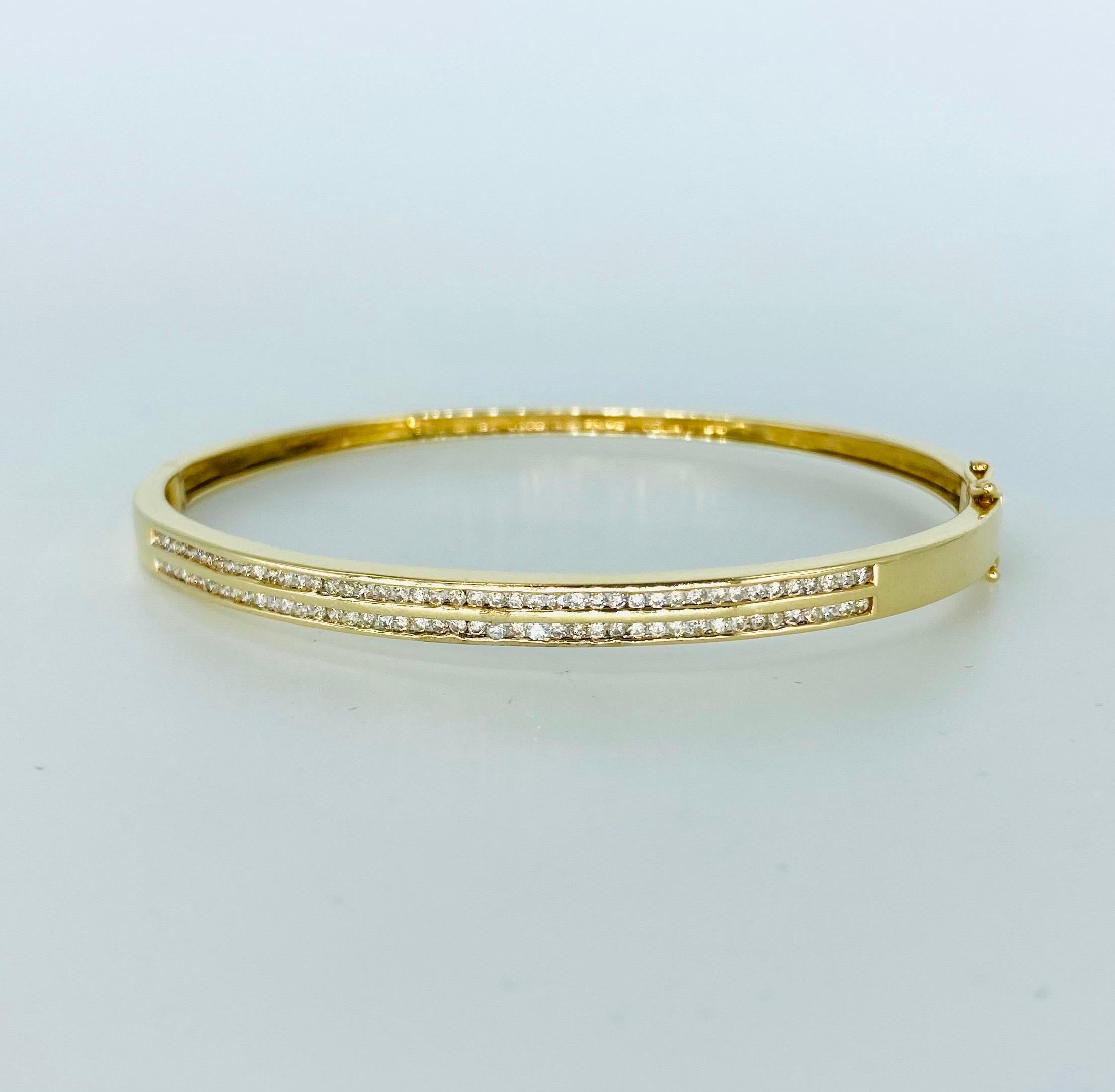 Vintage 1.75 Carat Two-Row Champagne Diamonds Bangle 14k Gold. The bangle features 88 round brilliant diamonds in champagne color. The bangle weights 11 grams 14k gold and measures 4.5mm in height. The bangle fits up to 7 inches wrist.
