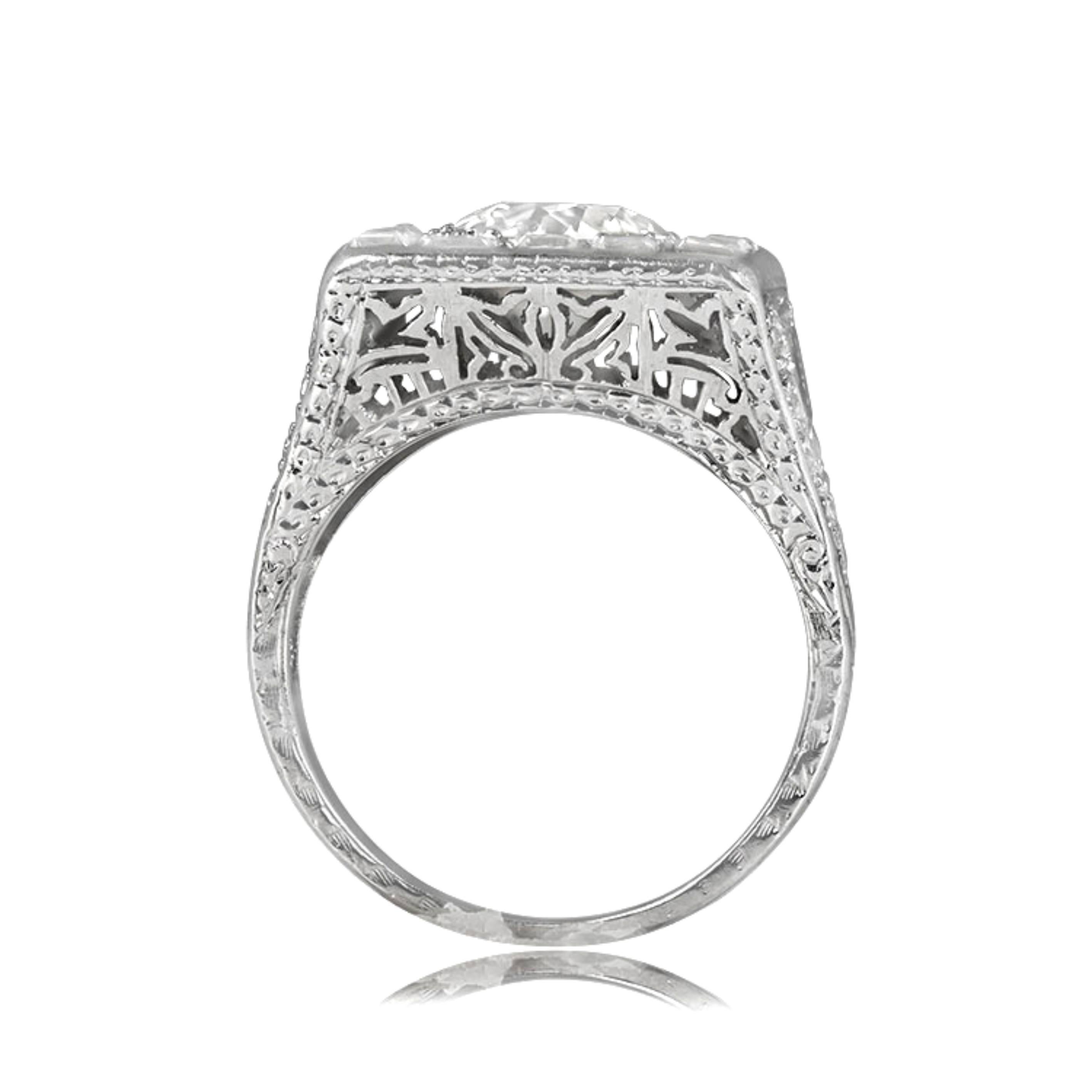 Art Deco era diamond halo engagement ring with 1.75ct old European cut diamond in K color, VS2 clarity, box prong-set with small old European cut diamonds. Features antique carre and trillion cut diamonds, floral openwork under-gallery,