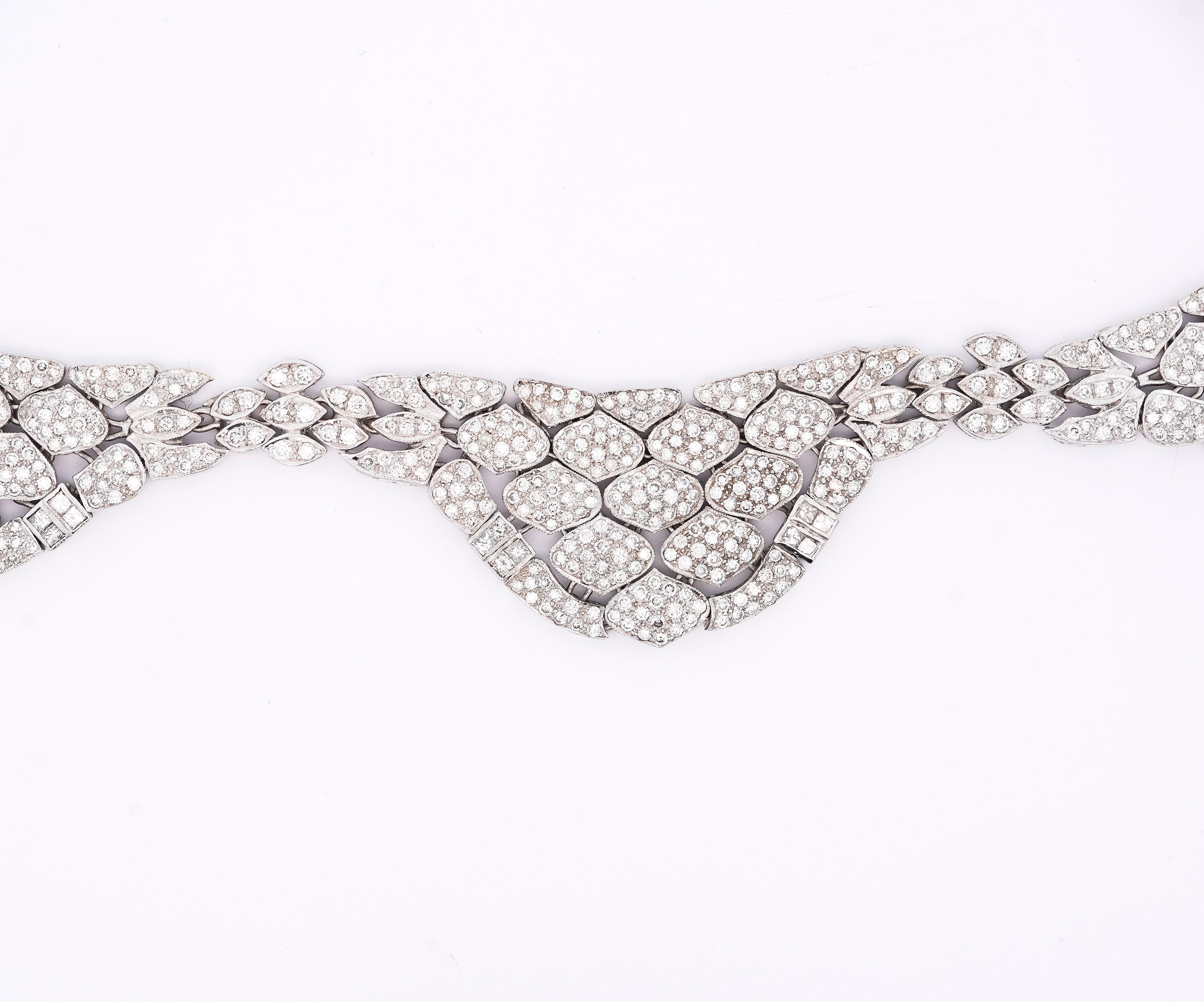 Vintage 17.6 Carat Round-Brilliant Cut Diamond Choker Necklace. This diamond choker is crafted from 18K white gold, weighs 50.1 grams, is in a bezel setting, and is 15 inches in length. The diamond color ranges from G-H with VS-SI clarity. The