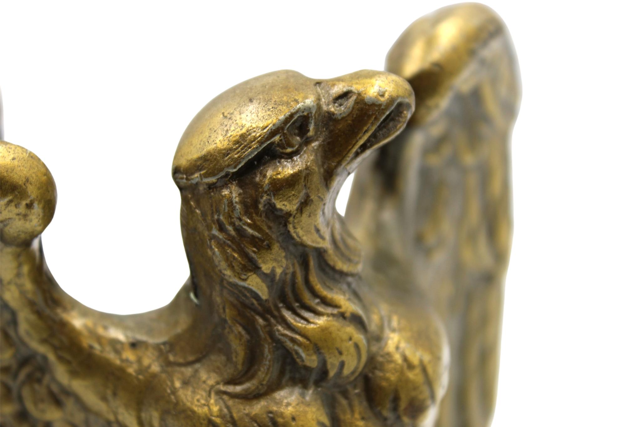 These appealing vintage brass bookends depict a bald eagle preparing for flight after perching on a base inscribed with “1776.” The bookends were made by Colonial Virginia, a crafter working out of Hampton, Virginia in 1972. The realistic detail of